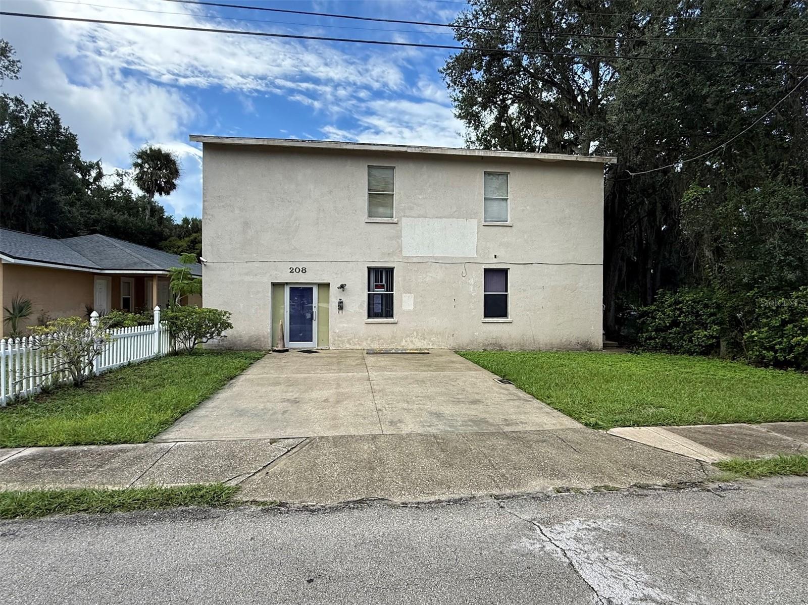 Nestled in the heart of Ormond Beach’s business district, 208 Midway Ave presents a rare opportunity for entrepreneurs and investors alike. This two-story, 2,688-square-foot commercial building sits on a 0.13-acre lot and is zoned for commercial use, making it an ideal space for entertainment ventures, business or community meetings or creative redevelopment. The property’s location is a standout feature — just off US-1 and close to the US-1 / Granada Blvd intersection, offering excellent visibility and accessibility. Surrounded by a mix of retail, dining, residential and service businesses, it benefits from steady traffic and a vibrant local economy. Inside, the building offers a flexible layout that can be adapted to suit a variety of business models or a mixed-use concept. The first floor of the building is 1,344-square-foot with central heating and air, two bathrooms, a kitchen, and a mechanical / storage room. There is an exterior stairway attached to the east side of the building giving access to the second floor / finished attic space. The second floor has one bathroom, a storage room, and an open meeting space. The second floor does not have central HVAC and was serviced by a window AC unit. The property was previously used as a club meeting location by a Florida Non-Profit. The building is a fixer-upper and in need of rehabilitation and repairs. Property is being sold as-is, please complete release of liability waiver prior to all showing requests. Whether you're looking to expand your portfolio or bring a new concept to life in one of Volusia County’s most active commercial corridors, 208 Midway Ave is a property with potential and promise.