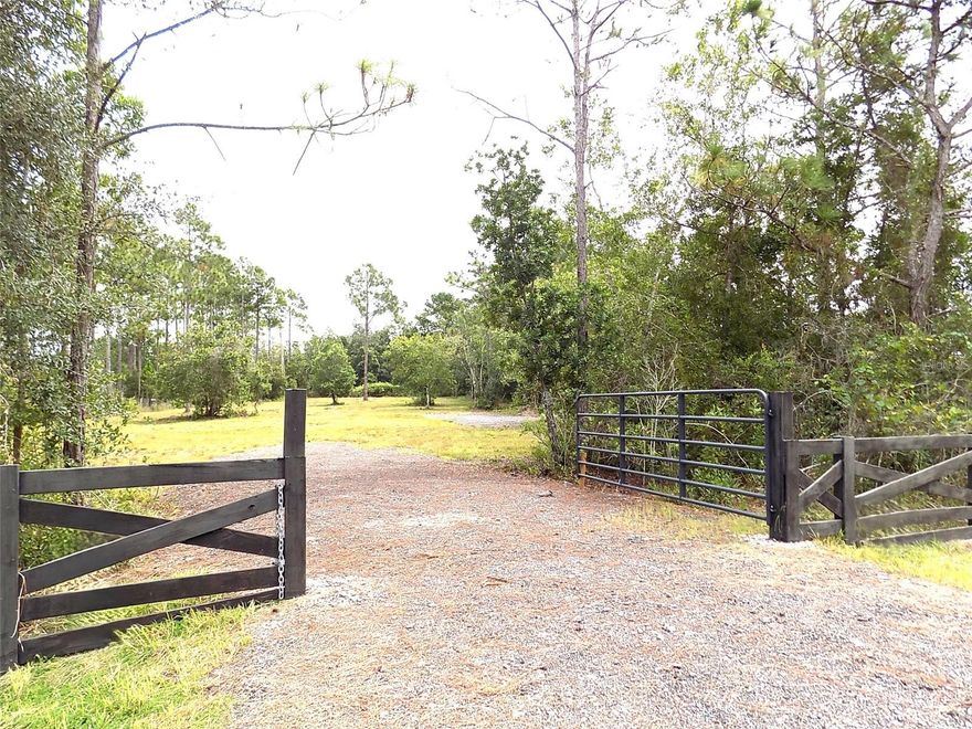 Looking for land? Welcome to this incredible opportunity to own 3.43 ACRES of land in the highly sought-after community of Bay Lake Ranch in St. Cloud, Florida. This acreage offers the ideal blend of privacy, space, and convenience—perfect for building the custom home of your dreams. The property features a cleared, buildable area ready for construction, along with a newly added driveway with millings and a new culvert, providing easy access from the road. The front of the lot is beautifully finished with custom wood fencing and a private gate, adding charm, security, and curb appeal. Build your dream home, add a pool, a workshop and more! The possibilities and potential growth for this land is hard to come by! Enjoy the country setting with a 20-minute drive to Saint Cloud shopping, dining, schools, and major roadways. This area is currently zoned for Harmony school district, buyer shall verify. With NO HOA, you’ll have the freedom to design and create a home that fits your lifestyle—whether it’s a modern farmhouse, equestrian estate, or luxury retreat. Build Your Dream Home in Bay Lake Ranch! Call today to schedule a tour before it's gone! All information is deemed reliable and shall be independently verified for buyers' use of land.