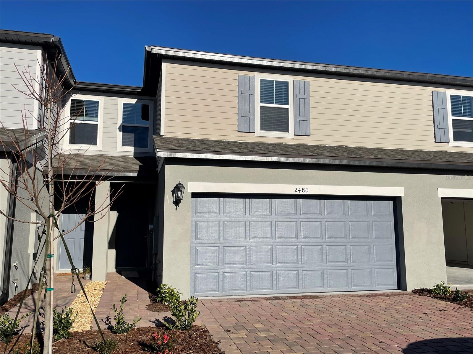 Welcome home to 2480 Sweet Viburnum Way, a 3 bedroom, 2.5 bath town home, built in 2021 with a view overlooking the pond. Upon entering the home, you're welcomed into the spacious kitchen overlooking the living and dining areas and views of the pond. You'll notice plenty of natural daylight through the multiple windows and sliding glass door leading through the living room to your covered back patio. The kitchen features a full suite of stainless steel appliances including the refrigerator, range, over the range microwave, dishwasher and disposal as well as plenty of cabinet and counter top space and a closet pantry. For convenience, there is also a half-bath/powder room on the first level easily accessible from the living areas . Continuing upstairs, the master suite is located separate from both guest bedrooms and features a spacious walk in closet and en-suite bath including a glass enclosed standing shower and dual vanity sinks. Both additional bedrooms are well sized and are connected by the jack and Jill bath which features a shower/tub combo. Rounding out this home is the upstairs laundry laundry room which will accommodate a full-sized washer and dryer and upgraded lighting and plumbing fixtures throughout, ceiling fans with light kits in the living area and bedrooms and the 2 car garage with automatic opener. Schedule to view this beautiful home as it will not last long!