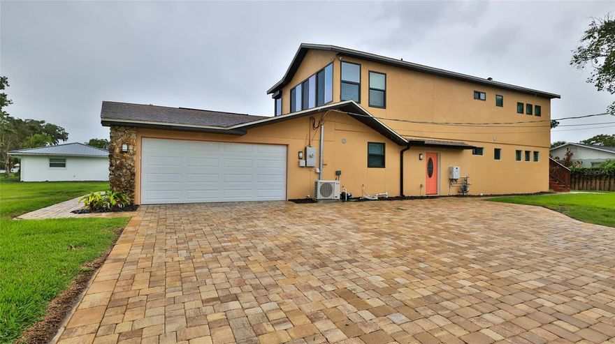 Location, location, location! Beautifully expanded in 2020, this spacious 4-bedroom, 3.5-bath home blends modern comfort with the relaxed Florida lifestyle. The two-story addition features full impact-rated windows and doors, while the original home received updated windows with hurricane protection in 2021. Home also had a new architectural shingle roof installed recently! (2020) 

Inside, the home is designed for efficiency and versatility. The original section is cooled by a geothermal central air system—quiet, durable, and free of exterior equipment—while the addition includes four heat-pump ductless mini-splits for personalized climate control. Both the new and existing areas are equipped with tankless water heaters (gas and electric).

A generous two-deep paved driveway accommodates up to eight vehicles, and the backyard offers a sizable paved patio perfect for outdoor dining or enjoying coastal breezes. A 10' x 16' gable-roof shed with upper storage, added in 2020, provides excellent extra space.

The downstairs portion of the new addition includes a full kitchen and laundry, making it ideal for an in-law suite or a rentable apartment. Its flexible design allows it to function as a separate unit or integrate seamlessly with the main home through double doors.

Upstairs, a glass-enclosed, air-conditioned balcony invites you to unwind while taking in views of rocket launches from the nearby space coast or fireworks over the beach.

Located just moments from the river, this home offers easy access to kayaking, boating, fishing, and the best of the Florida outdoor lifestyle. Enjoy peaceful mornings by the water, quick trips to the shoreline, and the unique blend of tranquility and adventure that this area is known for. All information is deemed to be accurate but is not guaranteed.