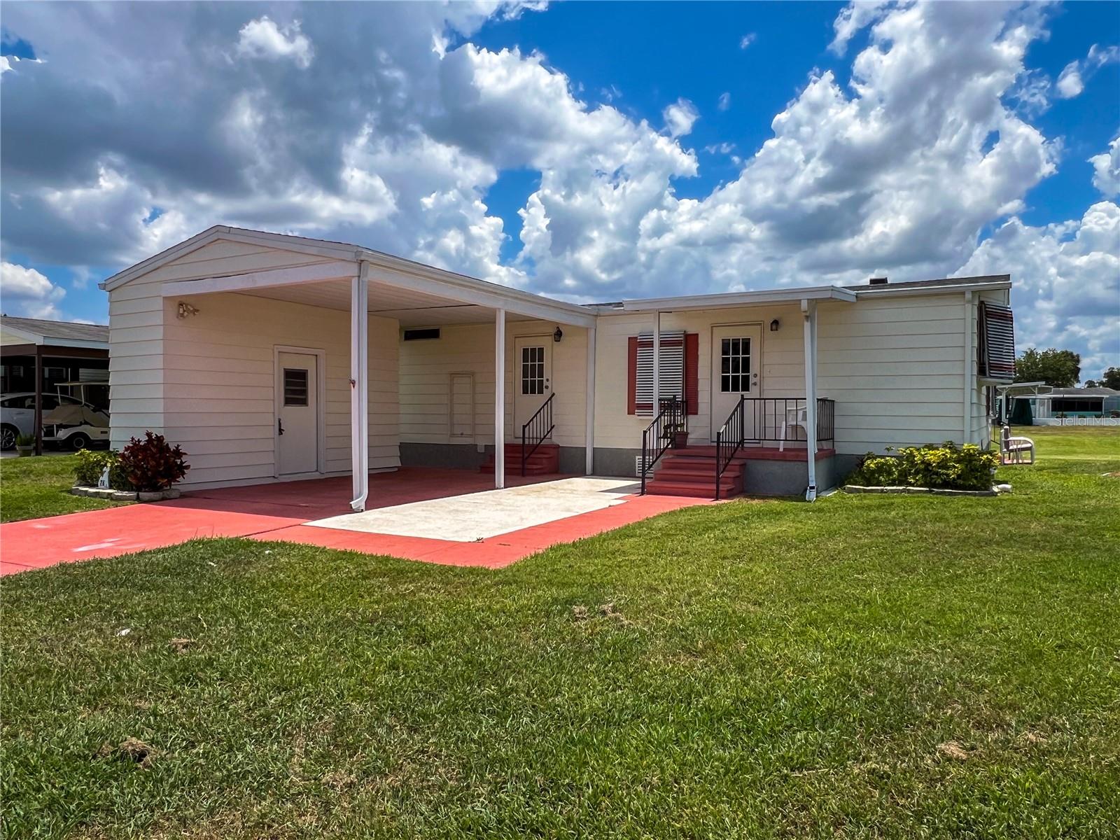 Land owned, 2bd/2ba home in the 55+ community of Ridgewood Oaks. This furnished home has an 0pen floorplan with large living room and spacious kitchen. New beautiful flooring throughout all rooms, with indoor washer and dryer. Primary bedroom hosts many windows and plenty of room for a king sized bed. Both bedrooms have walk-in closets. Lani has separate AC unit and has beautiful views of the lake and greenspace. Roof has recently been replaced. The home is located on a large lot and boasts an oversized carport space for extra car and golf cart. Cable, internet, lawn maintenance & sprinkler system are included with your low quarterly condo/HOA fees. The Ridgewood community features a beautiful clubhouse, pool, spa, tennis courts, pickle ball courts, shuffleboard and an outdoor fitness area. Golf cart and small pet friendly, Ridgewood has close access to I-75, many restaurants, the Ellenton Outlet Mall, the Manatee County Library and provides 24 hour gated security. If you are looking for a great Florida Home, don't let this one get away! Located on a quiet street with lots of community activities to enjoy in this 55+ community of Ridgewood Oaks. All room sizes are approximate. All information is deemed reliable but should be verified by buyers and buyer's agent.