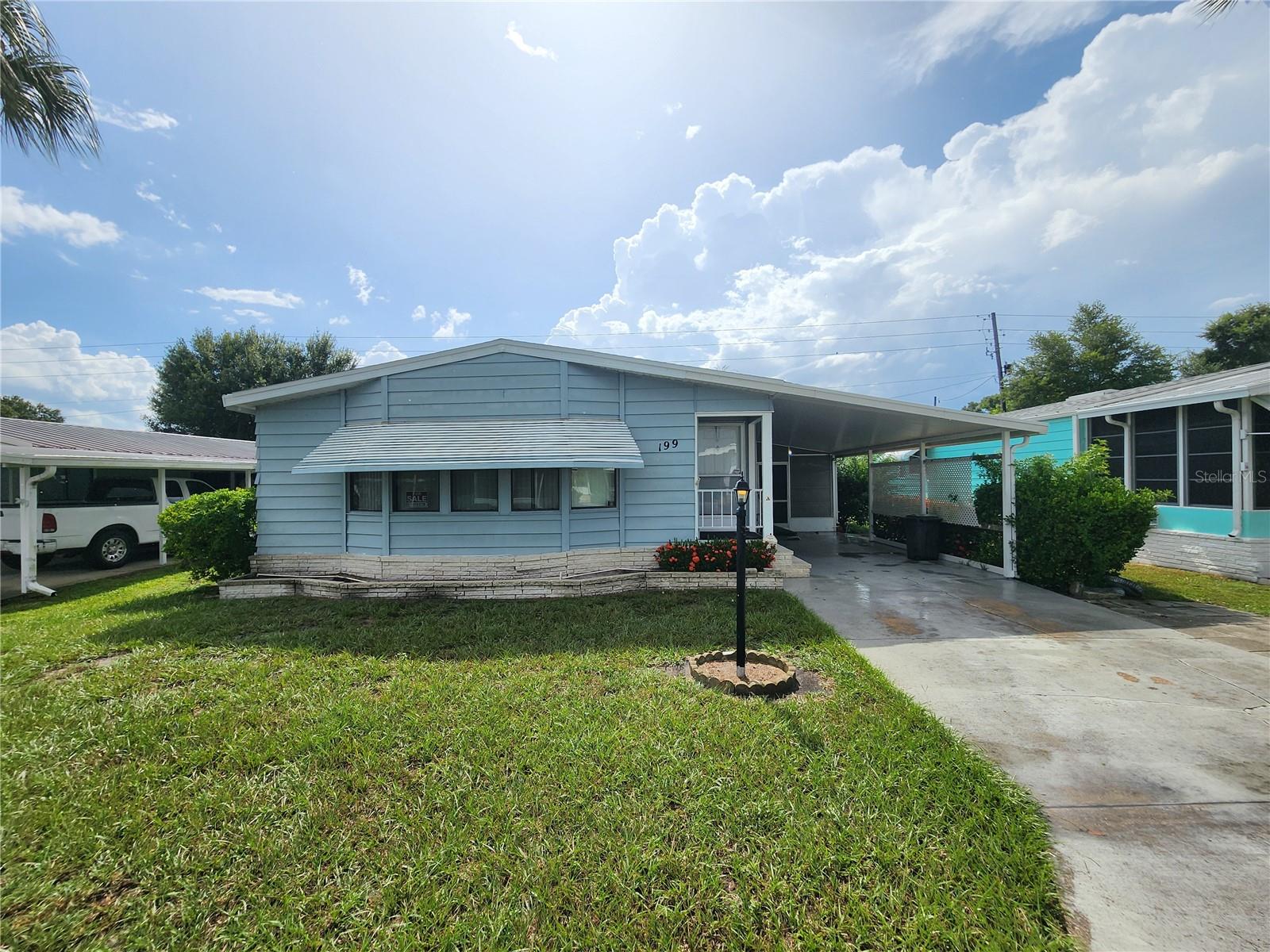 Become a share holder in this highly sought after 55+ gated community. If you are looking for the perfect retirement home, this one is for you! Located in Orange Manor West, it is one of the most popular 55+ communities in Winter Haven and surrounding area with many amenities. Pool, shuffle board, putt putt, horse shoes, crochet, bingo, lake access and much more. Legoland is around one mile away which is great for visiting family. This is a 1,568 Square ft. 2 bedroom 2 bath 1987 Palm Harbor mobile home. The king size master bedroom has a walk-in closet and a private bathroom with step in shower. The guest bedroom also has a walk-in closet. The monthly maintenance fee is $284.50 a month which includes cable, internet, trash pickup, and amenities. This house is partially furnished. This is also a pet free community. While it is a great winter home get away, it can also be a year round retirement home. This one won't last long. All measurements are approximate and should be verified by the buyer.