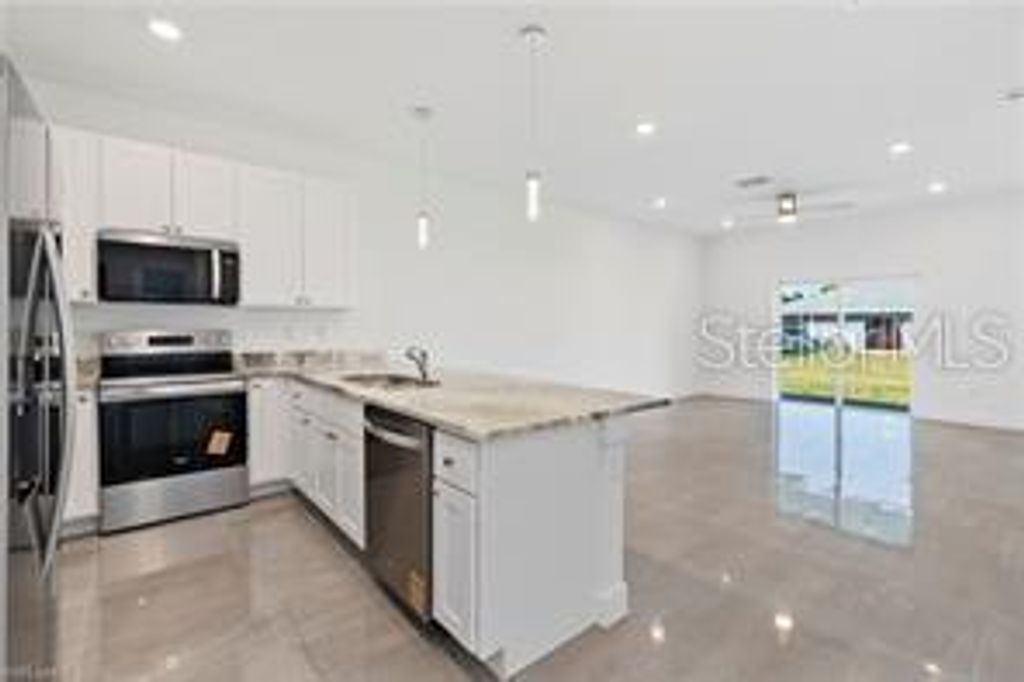 Photo of 326 Limerick Avenue S, Lehigh Acres, FL 33974 (MLS # TB8452404)