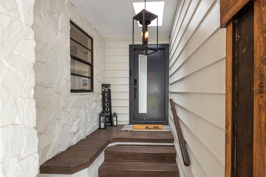 Welcome to this beautifully updated 3-bedroom, 2.5-bath, 2-car garage home nestled in a quiet, private, and well-established Seminole neighborhood—a true hidden gem sitting at a 10 ft elevation. This residence offers an inviting open floor plan highlighted by an updated kitchen with butcher block countertops and black stainless steel appliances, complemented by wood-inspired tile flooring throughout the main living areas, including the front entry and garage stairway. Thoughtful upgrades abound, including a newly renovated guest bathroom, custom entertainment center, new roof, updated insulation and vapor barrier in the crawl space, interior and exterior paint, luxury vinyl plank flooring in the primary bedroom and 1 other bedroom, new composite deck, trees have been removed, new front door, new drywall and insulation in the garage, all new closet doors, and a water softener system and much more. The AC system and gutters were replaced in 2020, offering added peace of mind. Enjoy cozy evenings by the wood-burning fireplace during cooler months or relax on the screened outdoor lanai. The oversized two-car garage features built-in storage and ample space for a boat or recreational toys—ideal for taking advantage of the public boat launch with direct Gulf access being only 2 miles away. All bedrooms are conveniently located on one side of the home, providing privacy and a functional separation from the main living areas. Ideally situated just minutes from the pristine beaches of Redington Shores and Indian Shores, and under 2 miles from Seminole City Center, offering easy access to shopping, dining, and everyday conveniences. Make us a reasonable offer.