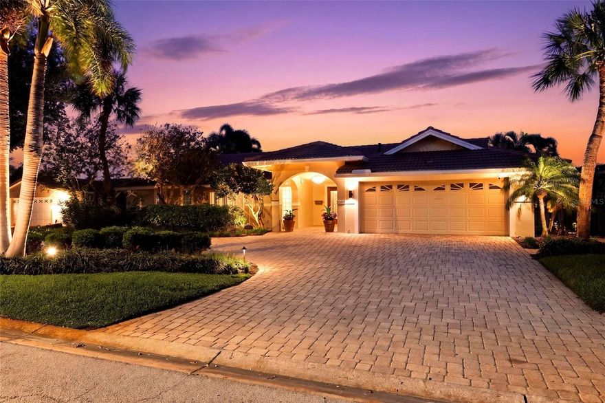 Welcome to 2080 Hawaii Avenue NE, a beautifully updated waterfront residence in the highly sought-after Venetian Isles community. Situated on over a quarter-acre lot (.28), and offering just under 3,200 square feet of indoor living space, this spacious home features 4 bedrooms, 4 full bathrooms, and a dedicated home office with built-ins.
Designed for both comfortable living and effortless entertaining, the home boasts a large family room anchored by a gas fireplace, and an oversized dining room ideal for hosting gatherings- complete with additional built-in storage cabinets and overflow counter space. Both rooms are surrounded by glass French doors with views of the pool and water for seamless indoor/outdoor living.
Step outside to a truly impressive outdoor living space, complete with incredible views of Tampa Bay and downtown Tampa. The massive backyard showcases a heated saltwater pool and spa, travertine paver patio, covered entertaining area, built-in gas fire pit, storage locker for miscellaneous patio items, fishing rod locker, and a fully equipped outdoor kitchen featuring bar seating, grill, storage, beverage refrigerator, ice maker, and a pergola for year-round enjoyment. Boating enthusiasts will appreciate the private dock with electric and water, along with a 10,000-pound boat lift providing quick access to open, unobstructed access to Tampa Bay.
The expansive indoor laundry room doubles as a butler’s pantry, complete with a catering-size refrigerator, ice maker, wine refrigerator, and beverage fridge. Additional highlights include tile flooring throughout, a barrel tile roof (2004), new HVAC system (2026), water heater (2019), updated electrical system (2026), new pool equipment (2026), and a seawall completed in 2010.
Venetian Isles is known for its friendly, welcoming community and unbeatable location. Just 4 miles from downtown St. Pete, you’re only minutes away by boat, bike, or golf cart from world-class dining, museums, parks, and nightlife. Add in quick access to Tampa International Airport and the award-winning Gulf beaches, and you’ll see why this is the waterfront lifestyle so many dream of.