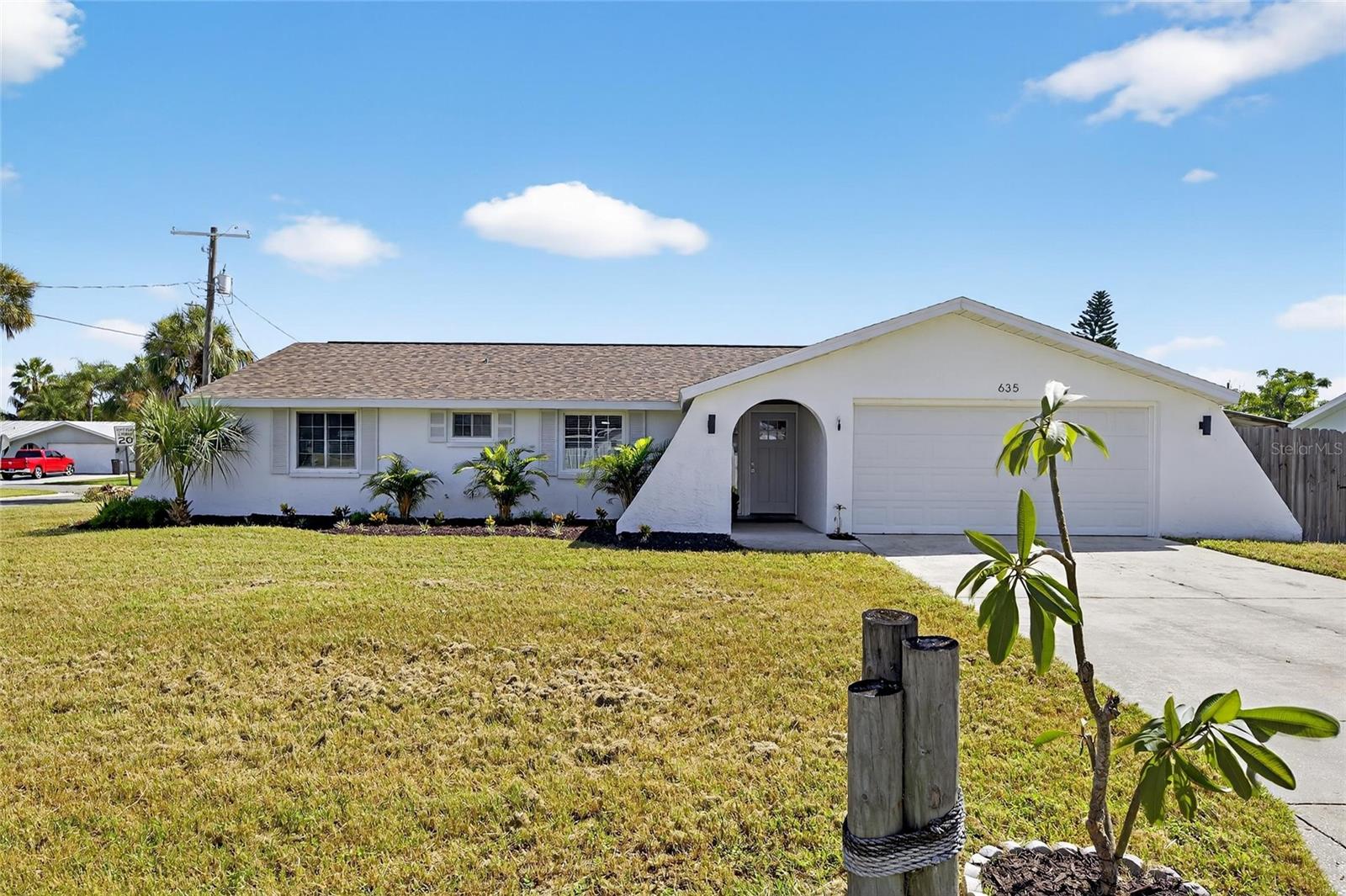 635 Jamaica Circle | 3 Beds | 2 Baths | 1,433 Sq Ft | Pool | No HOA/CDD
Located in the heart of Apollo Beach, this fully updated single-family pool home has 3 bedrooms, 2 bathrooms, a 2-car garage, and inside laundry. The home features new flooring, a completely renovated kitchen with quartz countertops, a coastal blue backsplash, and new appliances. Both bathrooms have been updated, with the primary suite including a walk-in shower and dual-sink vanity. Shiplap ceiling accents in the kitchen and great room add a coastal modern feel.
Step outside to a covered patio overlooking the pool, with a recent refresh on landscaping. The garage provides plenty of storage for beach gear, toys, or vehicles. Roof was replaced in 2020.
This move-in ready home is in a short-term rental friendly neighborhood with no HOA or CDD, just minutes from Apollo Beach attractions including waterfront dining, nature preserves, walking trails, and the beach. Perfect for full-time living, a vacation home, or an investment property.
