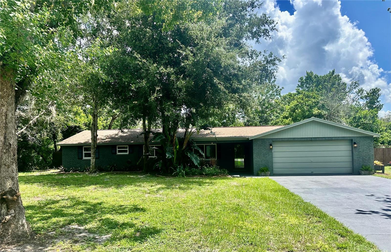 Welcome to your perfect Florida-lifestyle home with an in-ground screened-in pool/deck area
on a half acre lot. The property is perfectly tucked away on a cul-de-sac in a quiet neighborhood with no HOA. This home offers an all-new modern feel inside, and the opportunity to create your own tranquil space outside too! The gorgeous interior features an open great room and kitchen area with an island space and seating for colorful and fun conversations. Enjoy the Florida room as an entertaining space big enough to accommodate a pool table and games. Unwind in the den which includes a wood-burning fireplace, perfectly located next to the master suite, with barn doors, for additional privacy. The floorplan is a split plan with the master on one side, and the secondary bedrooms on the other. With all new cabinets, vanities, Quartz countertops, LVP flooring, showers, appliances and lighting, this home is a true gem waiting for its new owners to make their personal oasis! It is conveniently located right off State Road 52, 7 miles from US 19 and 4.5 miles to the Veterans Expressway to access all the restaurants and entertainment venues in the multi-county area. With no HOA, the property can accommodate all your toys including boats, trucks and RVs. The property is zoned R2 with the possibility of expanding with an inlaw unit and/or ADU.