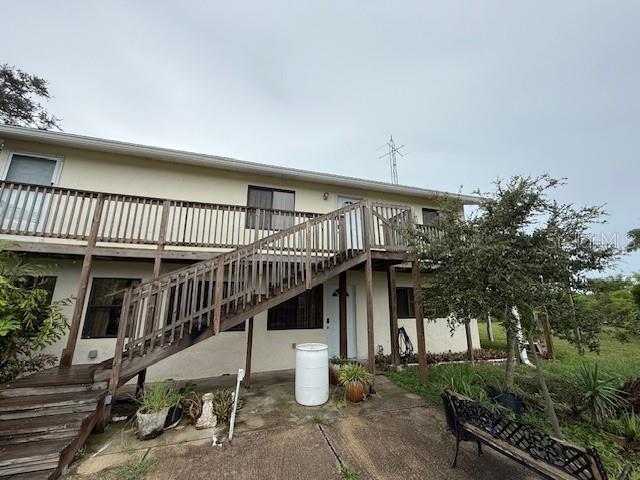 RARE OPPORTUNITY to own 4.7 acres in Sarasota County! This property is a dream come true if you are looking for privacy, serenity, and upside potential. NO HOA OR DEED RESTRICTIONS. The property features a custom 3,000 sq ft garage and workspace with 3 oversized doors. This garage / workshop space can’t be found anywhere else – lots of room for car enthusiasts, work trucks and vans, large equipment, RVs, campers and boats and anything else a workman, hobby-lover, business owner, boater, or outdoorsman would ever want or need. And with the privacy and location the property offers, this opportunity can’t be matched. This large garage space also features a bathroom and laundry area and it has full electric power and water. The nearly 5 acres is mostly wooded with a large, private driveway at the end of the main street. However, there are ample manicured grounds surrounding the main dwelling; perfect for cookouts and entertainment. The main house is divided into two living units with separate entrances – an upstairs and a downstairs. The home is quaint and has a ton of potential and features real oak wood flooring in the living area. You could live in one area and rent out the other if you choose. Lots of grounds space for parking, play and pets. The location is also a dream – privacy and acreage in Sarasota County with public utilities but just a 2-5 miles away you are stepping foot on Manasota Beach, Blind Pass Beach and Englewood Beach! The beaches have restrooms, showers, picnic areas and amazing sunsets! You also are near stores, restaurants and everything else you would want. It is the perfect property featuring country living near all modern conveniences. Private showings only. Call us to schedule your time today.