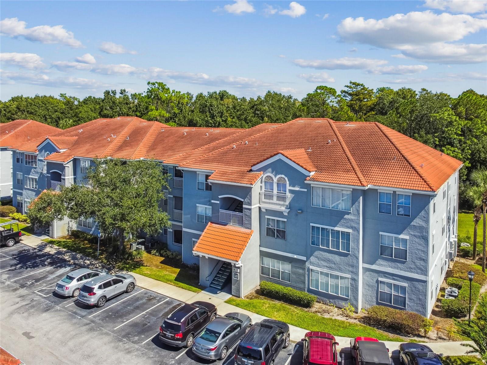 One or more photo(s) has been virtually staged. Luxurious Move-In Ready 2-Bedroom, 2-Bath Condo in the Gated Enclave at Richmond Place! Welcome to this beautifully updated second-floor residence located in the highly sought-after gated community of Richmond Place in New Tampa. This elegant 2-bedroom, 2-bath condo seamlessly blends style, comfort, and convenience with a modern open layout designed for today’s lifestyle. The stylish kitchen is a chef’s delight, featuring granite countertops, a decorative backsplash, open shelving, and brand-new stainless-steel appliances—including a refrigerator, range, microwave, and dishwasher. The kitchen opens to the spacious living and dining rooms, creating a warm and inviting space perfect for entertaining family and friends. Step inside to discover fresh interior paint, new luxury vinyl plank flooring, and crown molding that adds a touch of sophistication. The living room features sliding glass doors that open to a private balcony, offering a peaceful outdoor retreat to enjoy your morning coffee or unwind in the evening. Both bedrooms offer new plush carpeting, creating cozy private spaces, while the updated bathrooms showcase granite-topped vanities, ample storage, and elegant lighting for a spa-like feel. Enjoy a resort-style lifestyle with Richmond Place’s exceptional amenities, including a clubhouse, sparkling swimming pool, fitness center, tennis and volleyball courts, playground, and a car wash station. Perfectly located near USF, I-75, and Bruce B. Downs Blvd, and just minutes from top-rated schools, shopping, dining, and entertainment, this home offers the ideal blend of tranquility and accessibility. Whether you’re a first-time homebuyer, downsizing, or seeking a smart investment opportunity, this stunning condo is move-in ready, beautifully updated, and perfectly situated to enjoy the best of New Tampa living!
