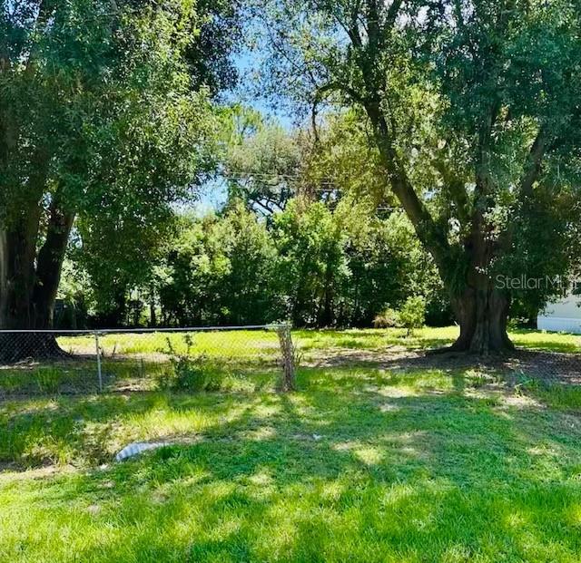 This charming, easy-to-maintain lot in Auburndale gives the opportunity to design the lifestyle you’ve always imagined- with no HOA restrictions. Whether you’re ready to build your forever home, a vacation retreat, or an investment property, this prime location puts everything Florida has to enjoy right at your fingertips. Spend quiet mornings fishing or kayaking on the area’s scenic lakes, or take an evening stroll by the water. Enjoy weekend adventures with quick drives to Walt Disney World, Universal Studios, and LEGOLAND. With shopping, dining, and entertainment nearby, you’ll have the convenience you need and the serenity you crave. Build where you can grow your roots and your dreams, whether it’s raising a family, retiring in comfort, or creating a beautiful getaway for future memories. With easy access to major highways, your future home will be perfectly situated for both daily living and Florida fun.
Looking for more space? The mobile home next door is also available, giving you the chance to own a double lot. Ideal for expanding your outdoor space or creating a multi-generational setup.