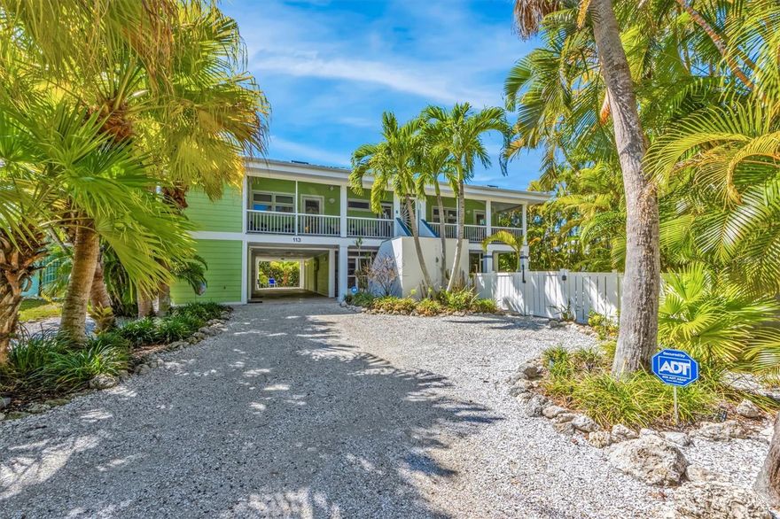 Escape to the tropical paradise of Coco Cottage, a charming and spacious 3-bedroom, 3-bathroom retreat with a bonus room, tucked away in the heart of the picturesque Anna Maria Island. As soon as you walk through the front door, you are greeted by beautifully decorated open floor plan with light and bright atmosphere, high ceilings and gorgeous exposed beams. The Chef’s kitchen has custom kitchen cabinets, Cesar stone Quartz countertops, Subzero refrigerator, Miele Kitchen appliances and a built-in wine refrigerator. There is ¾" wood maple flooring throughout, apart from the primary bedroom which has high end wool carpet. The main living level has the primary bedroom with direct access to rear balcony, 2 large walk-in closets, and ensuite bathroom with soaking tub and walk-in shower. Also another bedroom with direct access to front lanai, and ensuite bathroom with walk-in shower and the third queen bedroom and a shared hall bathroom. The top level has a bonus room with a queen bed and there is a loft area with a cozy window seat under the skylight and desk area! You will be amazed by the spacious pool area; relax in the heated saltwater pool or launch your Kayak off the dock into the lagoon. Relax and unwind in style on the screened second-floor lanai in the front of the house, where you can sip your morning coffee as you breathe in the fresh island air. At the back, an open second-floor deck awaits, perfect for soaking up the sun or stargazing at night. This home was designed by and remodeled by an Architect/Structural Engineer and an Interior Designer - they left nothing out: Standing Seam metal roof, impact resistant windows, sliding glass doors and skylights, Concord elevator, large screen room below house and open deck with retractable awning facing west. The location of this house could not be better, 4 minute walk to the Gulf of Mexico beaches or stroll down the street to Pine Ave where you will find many shops and places to eat! Schedule your showing today!