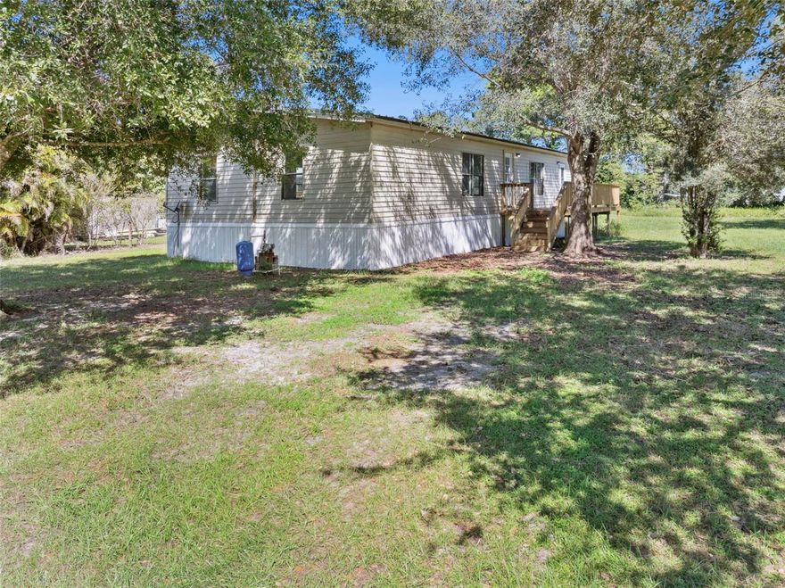 Quiet country living on this half acre lot in Arcadia, Florida. This spacious manufactured home has been recently renovated with fresh paint, flooring, new appliances, fixtures and bathrooms and kitchen. Over 1800sqft of living space, 3 bedrooms and 2 bathrooms, you have a designated dining area, kitchenette/bar in the kitchen, split bedroom floor-plan, and tons of natural light. The exterior has new skirting and decks for enjoying your property, shaded with mature trees. Plenty of space to add a garage and plant a garden, this house is move-in-ready!