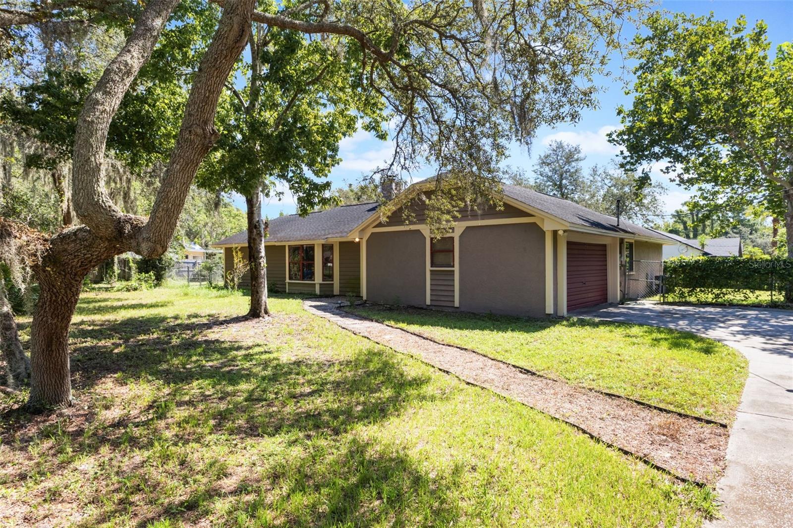 Welcome to a rare opportunity in the heart of Oviedo—this charming 3-bedroom, 2-bathroom home is situated on an oversized lot with no HOA and has not been on the market in over 25 years. Tucked into one of Central Florida’s most sought-after communities, this property offers both location and lifestyle in a vibrant and welcoming area known for its top-rated schools, community parks, and family-friendly atmosphere.
Inside, you’ll find vaulted ceilings, an updated kitchen, and a warm, inviting living space centered around a wood-burning fireplace. The split floor plan offers privacy, while the spacious fenced backyard is perfect for pets, entertaining, or relaxing under the Florida sky. A 2-car garage and extended driveway provide plenty of space for storage and guests.
Oviedo continues to be one of the most popular places to call home in Florida—with its charming historic district, bustling farmers markets, award-winning restaurants, and a variety of shops and local eateries offering global cuisine. Whether you’re looking for a quiet night in or an exciting date night out, this city has it all.
Ideally located near UCF, Rollins College, Full Sail University, and top employers, this home also offers easy access to Florida’s famous east coast beaches, Orlando’s major theme parks, and Orlando International Airport. It’s the perfect fit for families, professors or investors looking to offset college dorms or own in one of the region’s most desirable areas.
Homes like this don’t come along often—make it yours today.