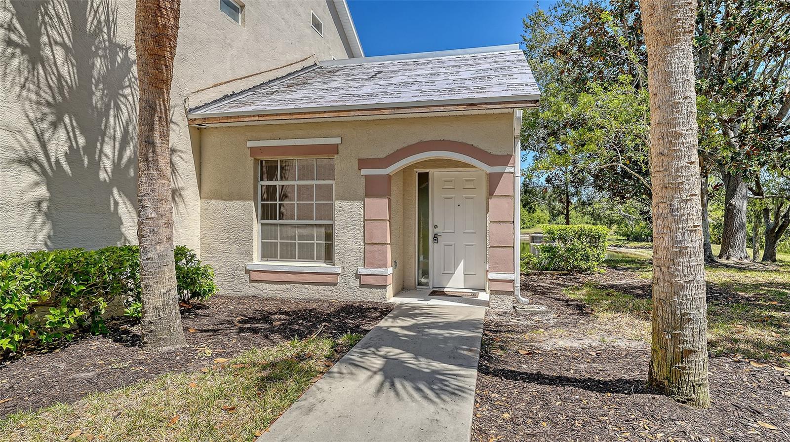Beautiful first-floor end unit condominium in Magnolia Crossing in the desirable Tara Preserves Community with water views and preserve. This home is bright with cathedral ceilings in the great room, tile flooring in the kitchen and baths. Fresh paint all throughout and new carpeting in the bedrooms. The main suite is spacious with carpeted floors, large walk-in closet and a private main bath with walk-in shower. An additional bedroom and full bath complete the open floor plan. The air-conditioning unit was updated in 2018. This unit is in a cut-de-sac, providing plenty of extra parking. The Preserves at Tara offers a community meeting room, community pool, hot tub, tennis and pickleball courts. Close to Interstate 75 and a short drive to the Gulf of Mexico Beaches, University Town Center Mall and many of the area's finest restaurants. Roof replacement is scheduled to be completed by mid-2025.