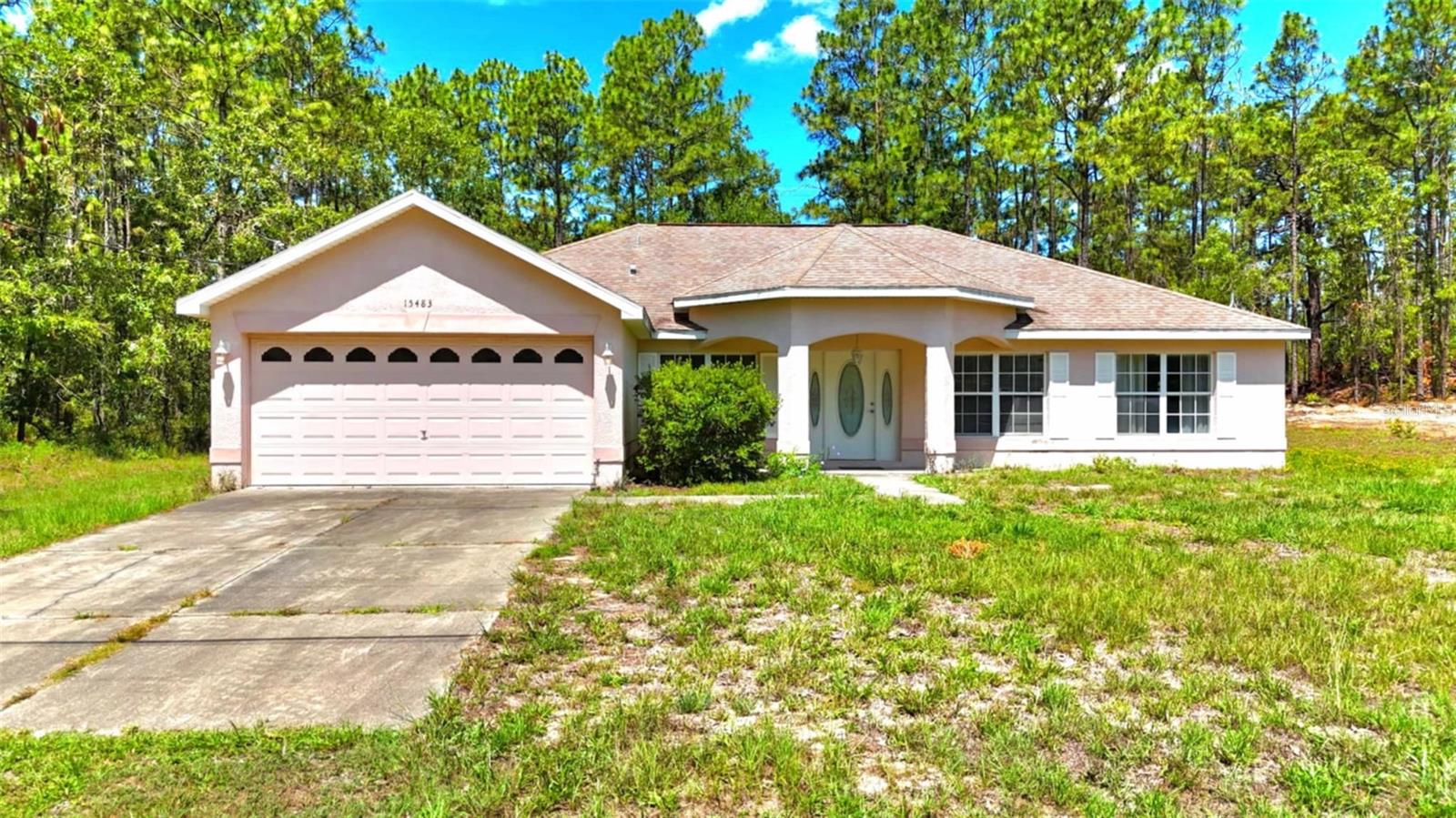 Welcome to this well-maintained 3-bedroom, 2-bathroom block home on a spacious half-acre lot, just minutes from the Gulf of Mexico and Florida’s beautiful natural springs. Whether you're looking for a primary residence, seasonal escape, or investment property, this home offers comfort, space, and a prime location. Step through elegant French doors into a bright, welcoming interior with two distinct living areas - a formal living room and a cozy family room - perfect for everyday living and entertaining. The kitchen features ample counter space, cabinetry, a dining nook, and a bar top for casual seating. The spacious master suite includes two walk-in closets and a private ensuite bath with double sinks. Two additional bedrooms share a full bathroom, making the layout functional and family-friendly. Recent updates include a new HVAC system (2019) and well pump (2022). Outdoors, enjoy a large irrigated lawn with plenty of space to garden, entertain, or add a pool. A 2-car garage offers storage and room for projects. Located near top natural attractions and coastal recreation, this property is a peaceful retreat with everyday convenience. Schedule your showing today!