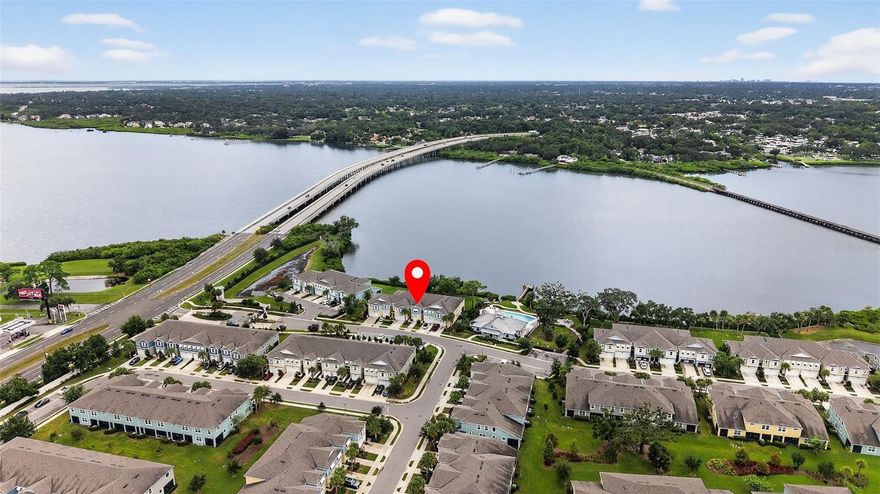 Waterfront Living at Its Finest!
Step into the pinnacle of waterfront living with this stunning 3-bedroom, 2.5-bath townhome overlooking the shimmering expanse of Tampa Bay. Built in 2018 and impeccably upgraded, this modern coastal retreat blends luxury, comfort, and high-end design within a beautiful gated community packed with resort-style amenities. Enter into a spacious open-concept layout where the heart of the home is the chef’s kitchen. Outfitted with stainless steel appliances, a large walk-in pantry, expansive granite countertops, shaker style cabinets and a generous center island with breakfast bar. This space is perfect for everything from casual meals to elegant entertainment. The kitchen flows seamlessly into a bright and airy family room with soaring ceilings and bay views — an ideal setting to start your day with coffee or host unforgettable gatherings. The main level also features a stylish half bath — a thoughtful touch that adds both function and flair.
Upstairs, retreat to the serene primary suite with calming water views, an elegant tray ceiling, and a spacious layout to include a generous walk-in closet, linen closet, and an additional double closet for exceptional storage and finally, the private ensuite bath which includes a walk-in shower and double vanity. A versatile loft offers flexible space for a home office, gym, playroom, or whatever fits your lifestyle. Two additional bedrooms, each featuring walk-in closets and sharing a full bath. A well-designed laundry room with custom shelving makes everyday chores effortless. Additional features include a one-car garage with overhead storage and abundant guest parking just steps away.
Outside your front door, enjoy an array of luxury community amenities: a stunning infinity-edge pool overlooking the bay, a state-of-the-art fitness center, and a cozy gas fire pit, perfect for sunset relaxation. Outdoor enthusiasts will love the fishing dock and dedicated kayak/paddleboard day storage, making it easy to launch right into the bay and paddle home after a day on the water. "Whether you're watching dolphins from your rare screened-in porch or enjoying a sunset paddle, this home offers the ultimate Florida lifestyle in one of the area’s most sought-after waterfront communities. Most importantly, it sits at a higher elevation and remained untouched by recent hurricanes." Don’t miss this rare opportunity to own your slice of paradise — schedule your private tour today!