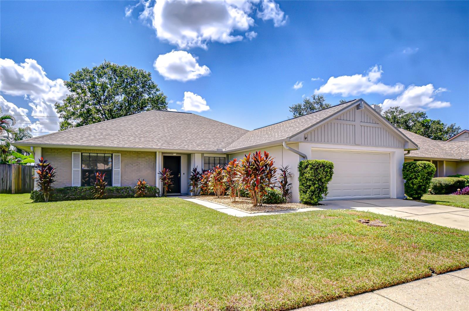 Welcome to your absolutely stunning home in Providence Lakes—one of Brandon’s most sought-after communities! Perfectly positioned in the heart of Brandon, this neighborhood offers it all: shopping, dining, entertainment, and convenient access to major highways connecting you throughout the Tampa Bay area—all with no CDD fees and a low HOA. Providence Lakes is known for its beautiful surroundings and community-focused amenities. Residents enjoy a park, recreation center, basketball and tennis courts, scenic walking and nature trails, and inviting picnic areas, making it easy to stay active, connect with neighbors, or simply unwind outdoors. This beautifully maintained 4-bedroom, 2-bath home is packed with updates, including a brand-new roof (2025), A/C unit (2023), water heater (2021), and upgraded vinyl flooring throughout the main living spaces. Step inside to soaring cathedral ceilings and abundant natural light, where a wood-burning fireplace creates a warm and inviting centerpiece. The spacious kitchen features upgraded soft-close cabinetry, granite countertops, stainless appliances, a large walk-in pantry, and breakfast bar seating—perfect for both everyday living and entertaining. The adjacent dining area makes hosting a breeze. The private primary suite is tucked away on one side of the home, offering a cozy window ledge for reading, a dual-sink vanity, a generous walk-in closet, and a separate shower room. On the opposite side, you’ll find three additional bedrooms sharing a large bathroom. A flexible front room provides endless possibilities—ideal for a home office, playroom, or creative space. Brand-new carpet has also been installed for a fresh, move-in-ready feel. Step outside to the backyard, where you can relax with morning coffee or enjoy gatherings with friends in a peaceful setting. With its prime location near the Brandon Mall, parks, and the Crosstown Expressway—and the bonus of no CDD and low HOA fees—this home truly combines comfort, convenience, and charm. Don’t miss your chance to embrace the Providence Lakes lifestyle! Copy and paste this link to tour the home virtually: my.matterport.com/show/?m=FhgG9wpwvha&mls=1