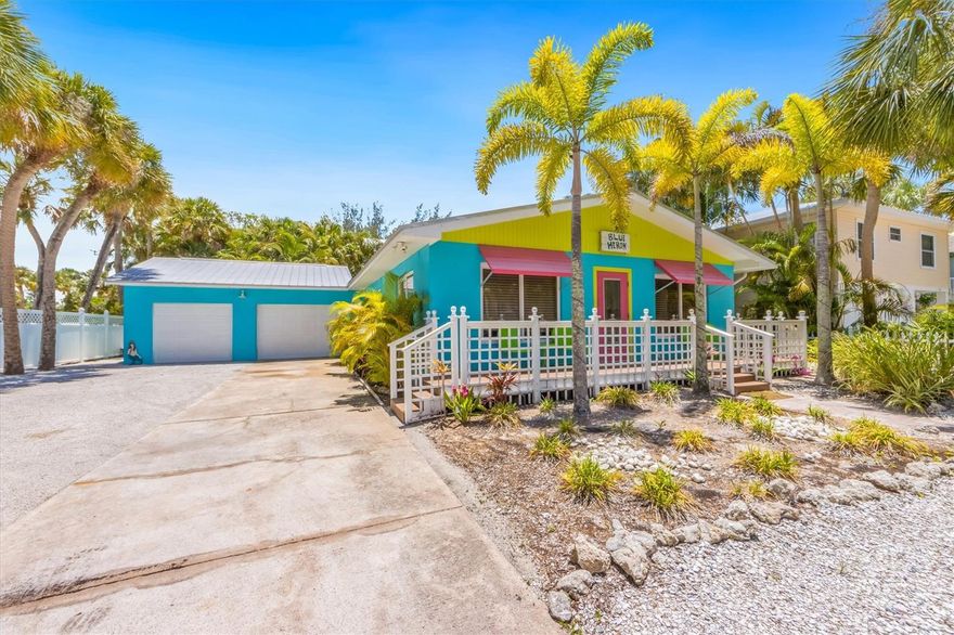 This charming beach cottage is 4 bedrooms, 2 bathrooms plus additional room and WEST of Gulf Dr!!!  No busy streets to cross and 6 houses from the Gulf of Mexico beaches.  Inspired by Key West charm, this lovely home was professionally decorated and renovated in 2019. Park in the one-car garage (there's driveway parking for five additional vehicles) and step inside, where you'll find two living areas and an open concept great for entertaining. This home sparkles with updated décor with vibrant colors, furnishings, bathrooms, kitchen, and barn wood tile floors. The kitchen has all you need to make delicious meals, with quartz countertops for a touch of luxury.  Outside, lounge on a recliner on the patio and soak up some rays, relax in the hammock, or take a swim in the heated pool.  There is hurricane windows and an outdoor shower as well.  Located so conveniently, you are just a short walk from popular restaurants like the Sandbar, Slim’s Place, and Beach Bistro. When you want to explore the island, catch the free trolley for a short ride downtown Anna Maria, Holmes Beach, or Bradenton Beach.