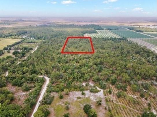 Discover the allure of this sprawling 5-acre parcel nestled on the outskirts of the sunny city of Bradenton, Florida, set just outside the tranquil expanse of Lakewood Ranch in Manatee County. This property borders the eastern region of the Del Webb Catalina at the Lakewood Ranch community. Experience the privacy afforded by this vast estate, complemented by nearby attractions, including a delightful winery, honey farm, and the serene Lake Manatee. Be an early investor in an ever-expanding community and embrace the essence of rustic living while enjoying convenient access to a wealth of shopping and recreational opportunities just minutes away.