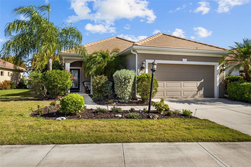 A lakefront pool home that delivers the Florida lifestyle—private, scenic, and built for effortless indoor-outdoor living. This three-bedroom home features a heated saltwater pool with spa and an open floor plan enhanced by crown molding, plantation shutters, and tray ceilings. The great room flows seamlessly into the kitchen and out to the lanai, where you can dine or unwind while overlooking the water and surrounding nature.

The kitchen is both stylish and functional with custom wood cabinetry, granite countertops, a natural gas range, and a spacious pantry. A split-bedroom layout provides privacy, while the primary suite enjoys pool views, two walk-in closets, dual sinks, and a walk-in shower. The outdoor space is designed for entertaining with an open pool deck and natural gas connection for a grill, making it easy to enjoy gatherings year-round.

Storm-ready features include hurricane shutters for the windows, roll-down shutters for the lanai, and a whole-house generator for added peace of mind. A two-car garage completes the home.

Located in Grand Palm, this amenity-rich, nature-focused community offers resort-style pools, fitness facilities, pickleball and tennis courts, dog parks, and miles of walking and biking trails, all just a short drive to downtown Venice and the Gulf beaches.