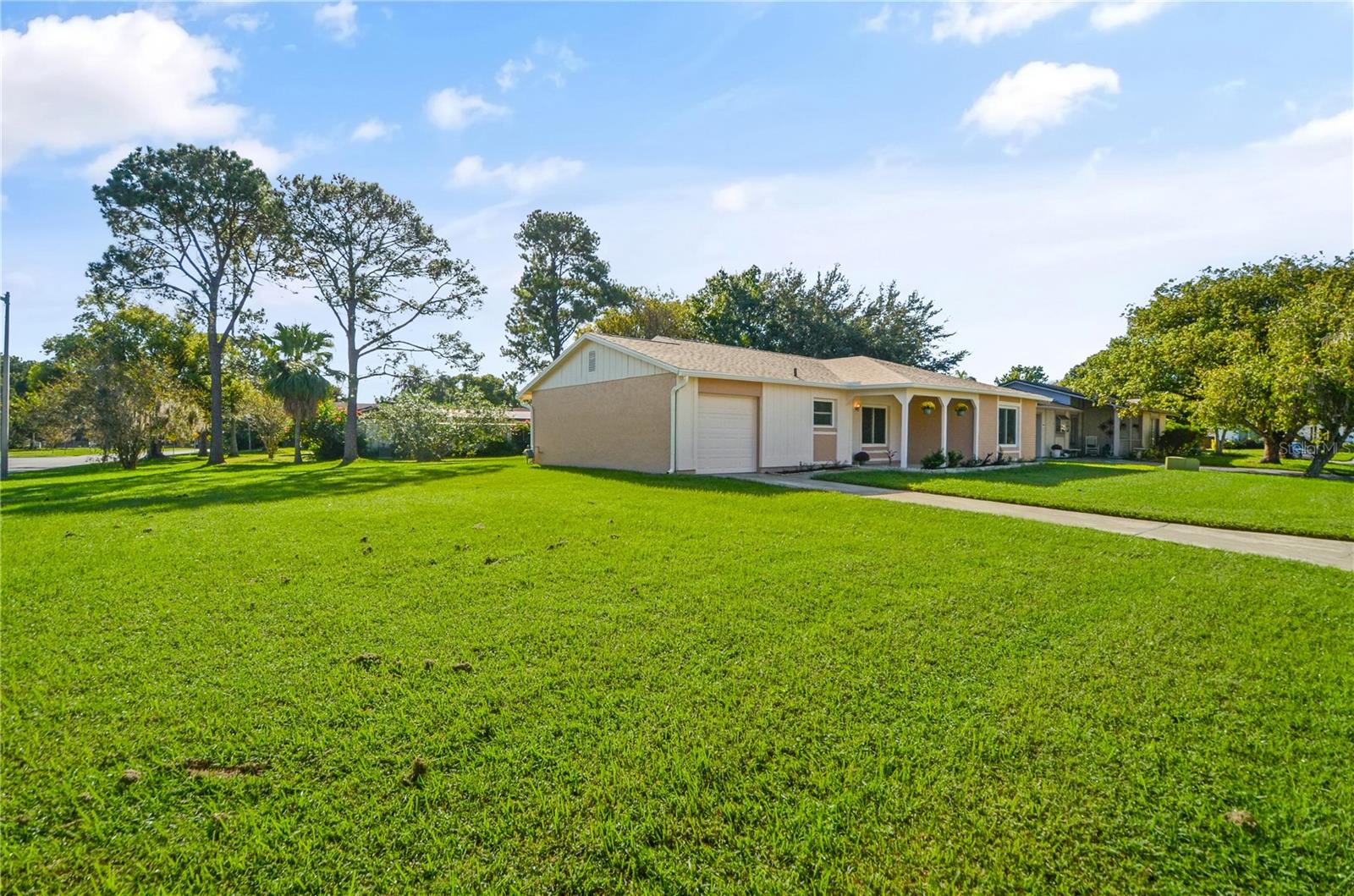 Wonderfully renovated on one of the Largest lots in Lake Ridge Village, Williamsburg. Tile throughout with new luxury vinyl. New roof, Kitchen cabinets, appliances, A/C with Gas furnace and duct work, bathroom vanities, water heater and electric panels all replaced in 2025. Best of all, the Low month HOA of $95 takes care of lawn cutting, edging and blowing. Perfect location near all the theme parks with fireworks all around the community. 20 mins to MCO airport and shopping/restaurants just blocks away.