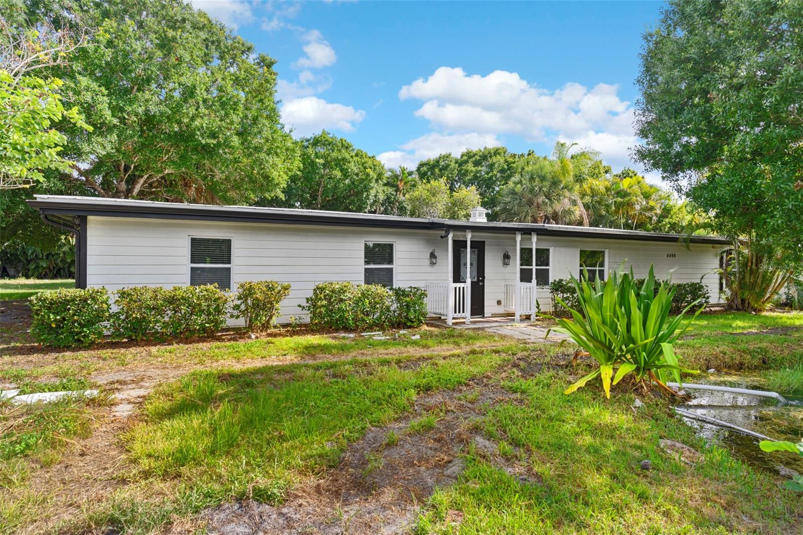 Discover the perfect blend of modern living and coastal charm in this beautifully remodeled 4-bedroom, 2-bath home featuring a separate 1-bedroom, 1-bath guest suite with a private kitchenette—ideal for guests, extended family, or rental income. Located in a quiet Vero Beach neighborhood, this property offers easy access to the area’s best shopping, dining, and attractions. Enjoy a short drive to the white sands of Atlantic beaches, Riverside Park, Round Island Oceanside Park, and the Indian River Lagoon for boating, kayaking, and nature trails. Just minutes from Historic Downtown Vero Beach, where you’ll find unique galleries, boutiques, live music events, and the monthly Downtown Fridays festival. Shop at Village Shops, browse local farmers’ markets, or dine at beloved hotspots like Cobalt, Ocean Grill, El Sid Taqueria, Citron Bistro, and Grind + Grape wine bar. Explore cultural treasures like the Vero Beach Museum of Art and McKee Botanical Garden, or sip craft brews at Walking Tree Brewery and American Icon Brewery. Inside, the home features bright, open living spaces, a modern kitchen with sleek finishes, spa-inspired bathrooms, and stylish flooring throughout. The seamless indoor-outdoor flow leads to a landscaped backyard, perfect for entertaining or relaxing in Florida’s sunshine. Whether you’re seeking a spacious family home, a multi-generational property, or an investment opportunity, this versatile gem offers unmatched value in one of Vero Beach’s most vibrant coastal communities. Don’t miss your chance—schedule your private showing today!