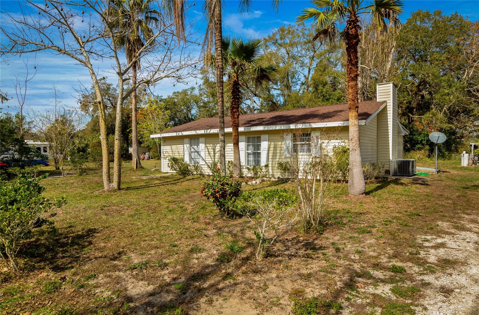 ***Back on Market no fault of sellers - buyers' financing fell thru*** Welcome to 18415 County Road 33, a charming 3-bedroom, 2-bathroom home situated on a half-acre just minutes outside the city of Groveland, Florida. Boasting approximately 1,000 square feet of living space, this cozy residence offers a blend of country tranquility and easy access to modern amenities.
Upon arrival, you'll be greeted by mature landscaping and ample yard space—perfect for gardening, outdoor play, or simply enjoying the Florida sunshine. Step inside to find a bright living area, a thoughtfully laid-out kitchen with plenty of cabinet space, and three comfortable bedrooms that can easily adapt to your needs—whether as guest quarters, a home office, or a personal retreat.
With no HOA, the half-acre lot offers endless possibilities for expansion, adding an outdoor entertainment space, or storing an RV/boat. Located just a short drive from major highways, shopping centers, local lakes and golf courses, this property provides the best of both worlds: a peaceful neighborhood setting combined with convenient access to nearby dining and recreation.
Whether you’re a first-time homebuyer, downsizing, or looking for a solid investment opportunity, 18415 County Road 33 is ready to welcome you home. Schedule your private showing today and see why this charming property is a must-see in Groveland!