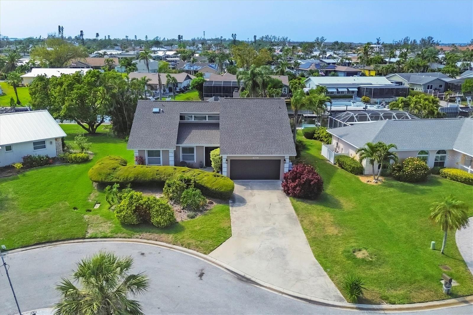 New Price for this STUNNING rarely available updated open concept waterfront canal pool home. Located in the sought after beautifully manicured tree lined boating community of Coral Shores East.
This home is truly a MUST SEE! From the breezeway entry, open your double front doors and step into paradise with soaring high vaulted ceilings and large travertine tile throughout. This home was meant for entertaining. The kitchen is equipped with top of the line stainless appliances, wine fridge, built-in dual tap kegerator, jenn air cooktop on the large spacious island so tastefully completed with granite stone counters and rich warm cabinetry. Every room in this home has had attention to detail from the lighting to the built in wall shelving on the feature fireplace wall. Beautiful french doors open up on the back of the home to a covered patio that goes out to a gorgeous heated pool where you can spend countless hours swimming, reading, sunning and enjoying the lifestyle Florida is all about. The home can be sold furnished or unfurnished with a few exceptions.
The list of newly completed upgrades is a long one with a new roof, new pool cage, new AC, hurricane shutters, newer windows and doors, hurricane garage door, and a freshly painted exterior all for your piece of mind.
Imagine yourself having your own private dock steps out your back door where you can boat to dinner, go fishing, kayaking, or take in a sunset. Just a few short minutes on the Intercoastal waterway and you can be out in the Gulf of Mexico with its blue azure water. Living just minutes from some of the most beautiful soft sandy beaches you can ride a bike to in just minutes , It's hard to beat the location of this neighborhood. Close to Anna Maria Island, Longboat Key, Saint Armands Circle, Great restaurants, shopping, parks, golf, IMG Academy, SRQ/Bradenton airport, hospitals. Set your private showing, but hurry, this home is one of those rare finds that won't last long. It's time to make your dreams a reality and call this amazing property your HOME!