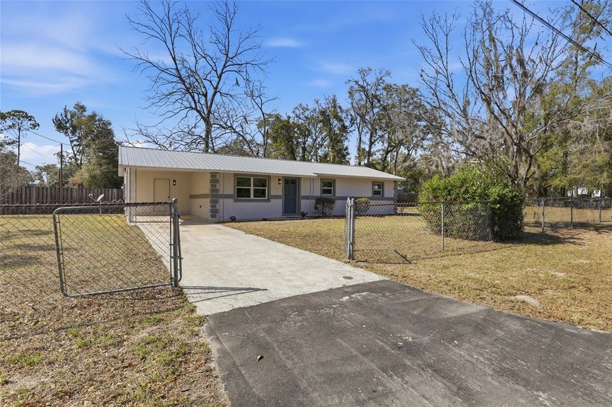 This updated 3-bed, 1-bath home on a corner lot in a quiet Newberry neighborhood offers recent improvements and functional living space. The property features a brand new metal roof installed in 2025, a brand new electrical panel upgrade (2025), and brand new windows (2025). Other updates include a new kitchen, bathroom, interior paint, and new flooring. The HVAC system was replaced in 2019. Constructed of stucco concrete block, the home provides durability and low-maintenance exterior finishes.  Interior living space includes a practical layout with updated finishes throughout. The refreshed kitchen and bathroom reflect recent improvements. The home is situated on a level corner lot with yard space and is located within easy access to local amenities and daily services.
