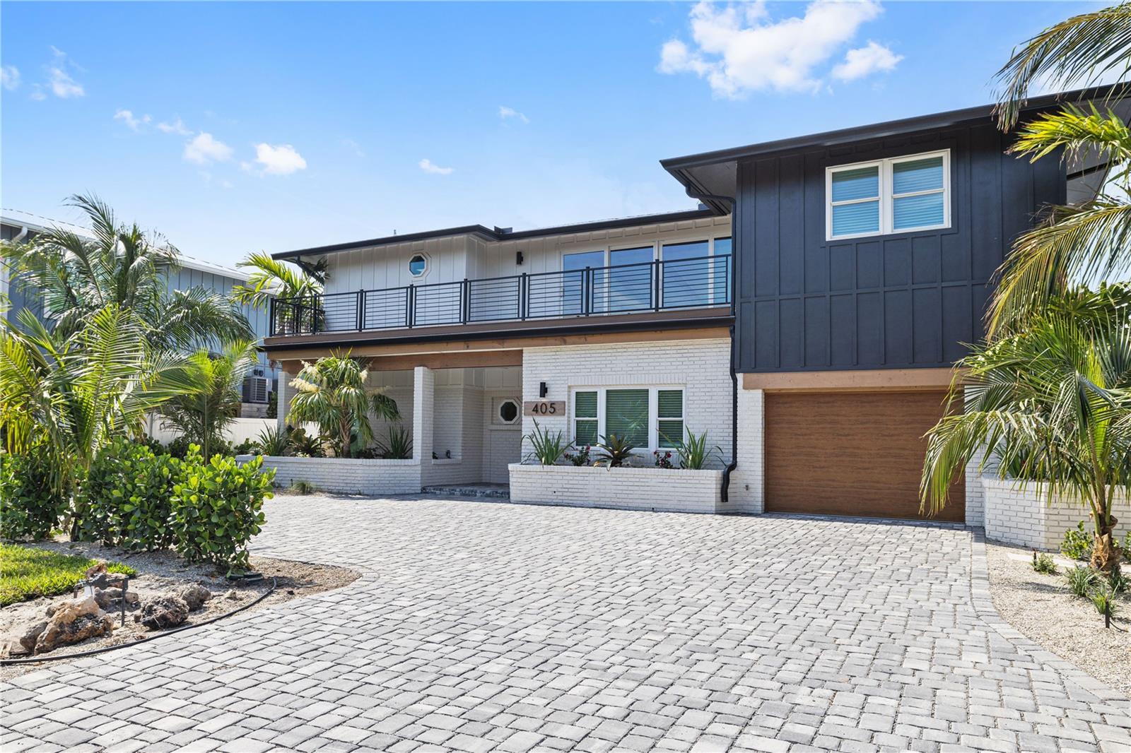 This newly renovated waterfront home has 80 feet of canal frontage including a dock and boat lift for up to 10,000 lbs. Perfect for easy access directly into the bay and located just a short stroll from the beach. Inside you will find a kitchen with high-end appliances overlooking the pool. The open concept living and dining area are perfect for both relaxation and living the island life, windows that fill the space with natural light and allow for all around water views. Six bedrooms all with brand new king mattresses. Two full master suites. One on first floor and one on second with oversized balcony access with views of the bay. This home offers the perfect blend of vacation vibes and convenience. Offered fully furnished. Stay for a couple months or a season!