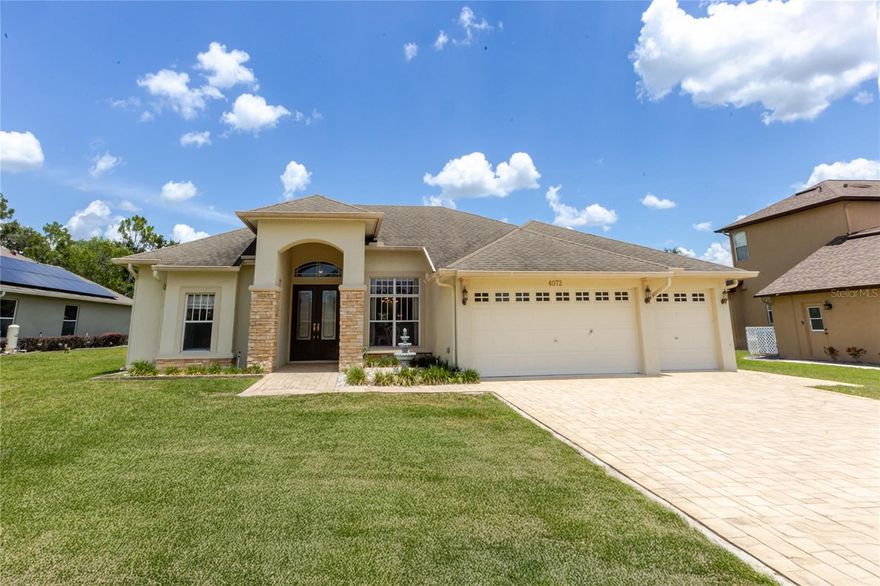 Located in the gated community of Pristine Place, this well-maintained 2005-built home offers 2,419 living square feet (3,277 total) with a functional layout designed for both comfort and privacy. A beautifully paved driveway and walkway lead to the inviting entrance, setting the tone from the moment you arrive.

This home features three bedrooms, three full bathrooms, and a spacious three-car garage. All bedrooms are positioned in a separate wing, offering added privacy. The owner’s suite is accessed through double doors and includes a large walk-in closet and plenty of room to relax.

Inside, you’ll find a formal living and dining room combination, along with a separate family room featuring an electric fireplace. Sliding glass doors in both the living and family rooms open to the outdoor living space, creating a seamless indoor-outdoor connection.

The kitchen offers ample storage, a double-sided pantry, and a breakfast area for everyday dining. All appliances convey, making this home move-in ready. The inside laundry room includes a washer, dryer, and utility sink for added convenience.

Step outside to enjoy the inground saltwater pool with a screened enclosure—ideal for year-round Florida living. Additional features include crown molding throughout and an A/C system replaced in 2014.

Conveniently located near the Suncoast Parkway, offering an easy commute to Tampa. Tampa International Airport is approximately 45 minutes away, Clearwater Beach is about 60 minutes, and the Disney parks are roughly 1.5 hours.

A well-rounded home offering space, function, and a desirable gated setting.