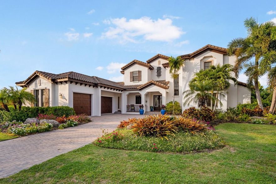 Exquisite Waterfront Pool Home with Dock and Water Access to Tampa Bay/Gulf of Mexico! Mindera Model Home for John Cannon Homes with the best location in MiraBay and minutes to the open waters of Tampa Bay. 4 Bedrooms, home office, bonus room and 4.5 baths.  Amazing outdoor space -- Sunny lanai with sparkling pool, outdoor kitchen and sitting area - relax & entertain poolside.  Dock with 12,000lb Lift, power & water make your next excursion to the open waters of Tampa Bay easier for you.  Beautiful custom home is everything you have been looking for and the furnishings and boat are negotiable as well. Tropical palm trees greet you as you enter the home through large custom french entry doors. Living Room offers stone wall feature, gas fireplace, wood beam ceiling and view of the pool and canal. The chef of the house will appreciate the kitchen, sub zero wolf appliance, walk-in pantry, center island with second sink and room for bar stool seating.  Dining room also offers a great view to the outdoor living area. Escape into your owner's suite featuring separate sitting area with pool view. Private bath includes walk-in shower, soaking tub, dual vanities, 2 large walk-in closets too.  Home office in the back of the house is next to a full bath. Junior Suite on main floor also has walk-in closet and private bath. Large laundry/utility room has plenty of storage and can be used as catering prep area as well.  Upstairs has two bedrooms, 2 baths and the bonus room!  Bonus room offers large balcony with a great view overlooking water/conservation area.  Paradise has come to you with this incredible outdoor space.  Plenty of room for your grilling, entertaining, relaxing and taking in the Florida Sunshine! Multiple spaces for outdoor dining, seating and lounging.  Pool with sun deck and spa overlook mangroves/water. Waterfront with dock to make your boating life easy and enjoy the perks of living off Tampa Bay.  Popular community of Mira Bay has resort style amenities & clubs for all ages. Tennis courts, basketball courts, pools with slides and clubhouse with cafe.  Tampa Bay is home to sporting events, culture events, near the famous Gulf Coast beaches(Clearwater, Siesta Key, Longboat Key, St. Pete) and easy trips to Sarasota or Orlando.  Bonus perk - vacant lot next door is also available for purchase with this property.