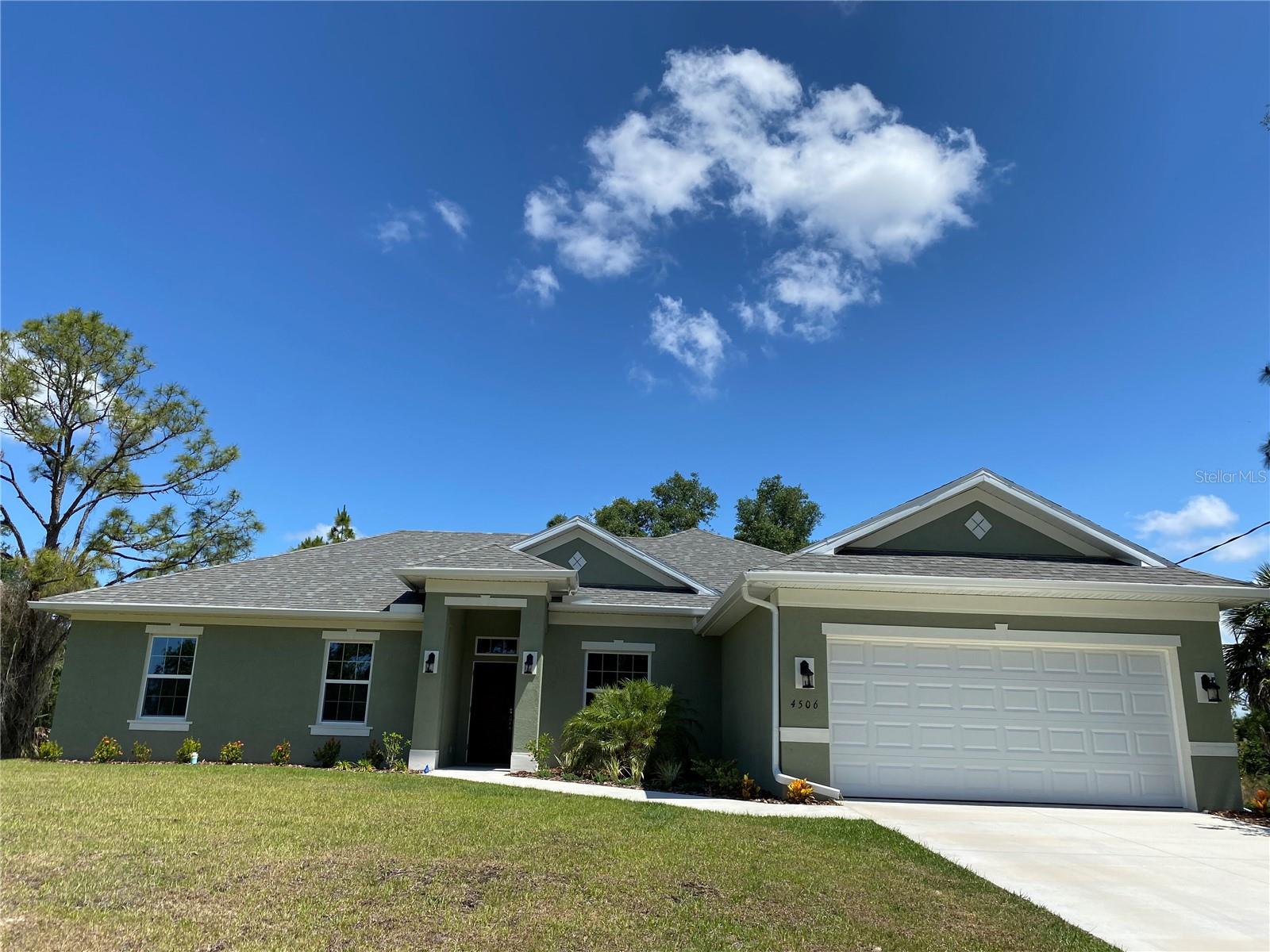 PRICE REDUCED!! MOVE IN READY! New construction home. Oversized Corner lot. Featuring 4 spacious Bedrooms. Open/split Floor Plan. 9'4" Ceilings. Granite Countertops. Kitchen has a breakfast island and plenty of Cabinets, Drawers and counter space. Laundry room with Cabinets and Granite countertop convenient for folding laundry. The Home has a combination of Ceramic Tile and Carpet. Primary Bathroom contains dual sinks, Garden Bathtub and separate walk in shower.