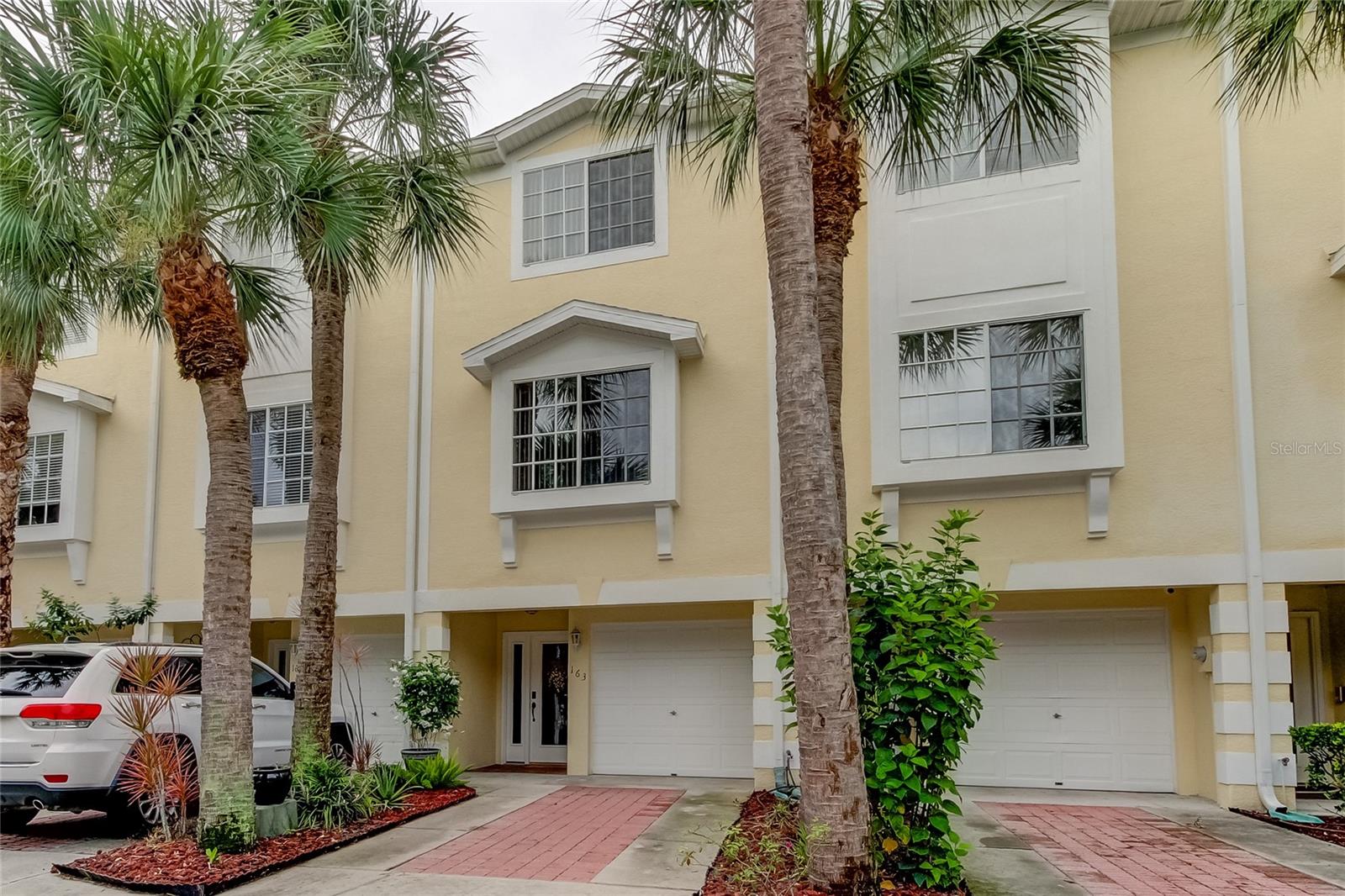 ** Deeded Boat Slip with Lift **Nestled in a serene, small gated community, this exquisite waterfront townhouse offers the perfect blend of luxury and tranquility. Located in the heart of Oldsmar, this home is a boater's paradise, complete with a deeded boat slip with a newer lift, for direct access to the pristine waters of Old Tampa Bay. Take the bike trail to Safety Harbor - or follow along the waterfront park enjoying open water views. Step inside to discover a private retreat that you thought was only possible in dreams. Upstairs to the main floor, the living and dining areas flow seamlessly onto a private balcony, where you can enjoy breathtaking sunset views over the water, making every evening feel like a vacation. The cozy kitchen shares in the spectacular water views and overlooks the dining/living area. This main floor also has a full bath and comfortably sized bedroom. Upstairs, the primary suite is a true retreat, with a spa-like en-suite bathroom, two walk-in closets, and its own private balcony overlooking the water. The additional upstairs bedroom is generously sized and has its own en suite bathroom, providing comfort and privacy for family and guests alike. The townhouse also includes a three-car tandem garage, ample storage, and access to community amenities such as a pool and picnic area. Whether you’re looking to relax by the water, take your boat out for a day on the bay, or simply enjoy the peaceful surroundings, this property has it all. Take comfort in knowing that all of the west facing sliders are impact rated and 2017 new roof and skylights. Even the dock and boat slip have been upgraded! 6,000 pound lift and lift motor are ready for your watercraft - deeded and right out your back door. Don't miss the opportunity to own this stunning waterfront townhome with unparalleled views and boating access in one of Oldsmar’s most desirable communities. Easy access to Clearwater Beach/Dunedin - Tampa International Airport