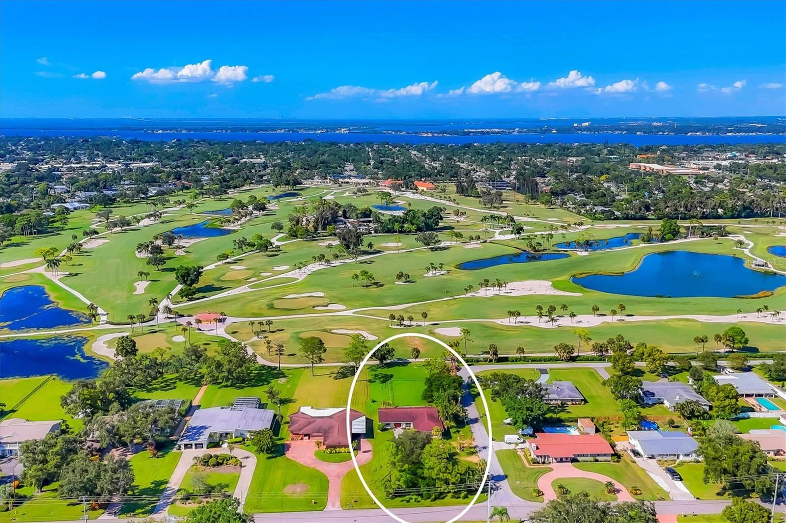 Colossal sized lot with expansive Bradenton Country Club Golf Course views! At 331.7' deep with 100' feet on the golf course it is suitable to subdivide into two lots on this quiet West Bradenton intersection with no HOA. Existing home could also be renovated into a dream home overlooking the 4th hole by the green. Beautiful Mexican tile floors throughout with beamed ceilings create a cool and spacious living area. An excellent investment project from any angle.