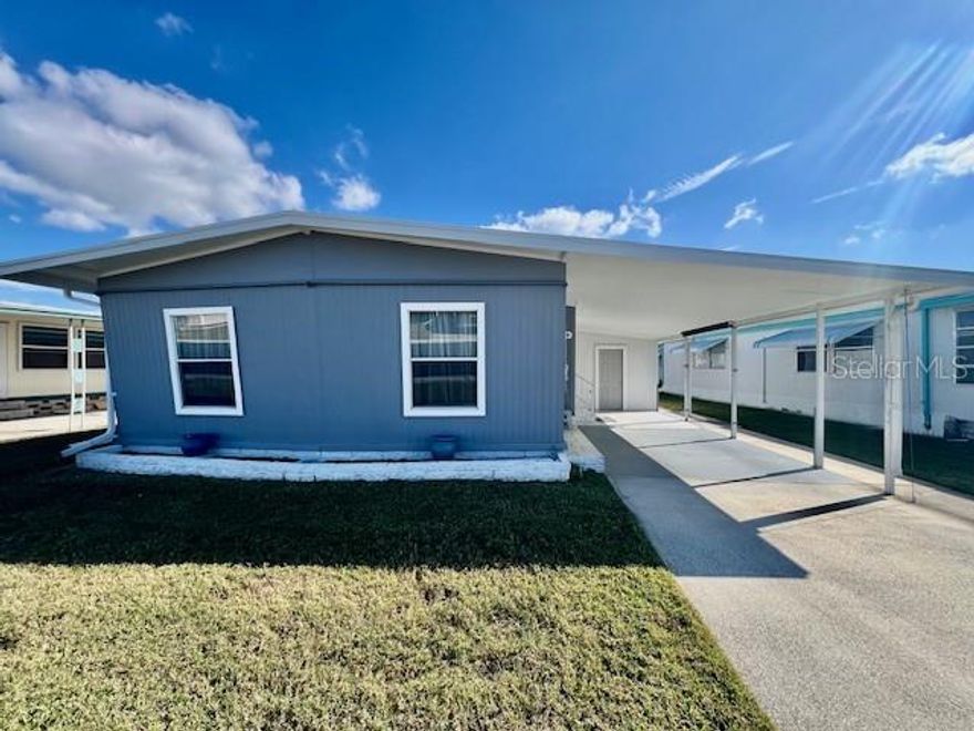 WELCOME TO YOUR AMAZING HOME at 10810 Freedom Dr, Port Richey in the gated community of Senate Manor, a 55+ cooperative community in SUNNY Florida. This 1973 MARVELOUS 2 bedrooms + Florida room, 2 bathrooms double-wide manufactured home lies on a GREAT lot with over 4000 sqft in a NO CDD zone. Key exterior features are LONG covered carport parking fitting multiple vehicles, concrete driveway, storage shed with washer/dryer included, rain gutters, private mailbox & easy-breezy TROPICAL landscaping that is taken care of for you. When you step inside, you'll LOVE the OPEN FLOOR PLAN consisting of the kitchen, living & dining rooms & HUGE lanai/Florida room. The floors are dressed with GORGEOUS wide-plank LUXURY LAMINATE in all the open areas while the bathrooms feature PORCELAIN TILE. The RENOVATED kitchen features a double sink, shaker-style, real-wood cabinets with hardware, butcher-block counters, geometric marble backsplash, pantry closet & stainless steel appliances including a smooth-top range, microwave & fridge. The SPACIOUS living room is a magnificent place for family gatherings & features double sliding glass doors to the Florida room where the party continues. This FL room features porcelain, wood-look tile, electric fireplace, built-in AC wall unit & ceiling fan. NATURAL SUNSHINE streams inside through the multiple DOUBLE-PANE, THERMAL-TINTED, LOW-E WINDOWS ILLUMINATING the interior together with the BRIGHT light fixtures. The HUGE primary bedroom can fit king-size furniture & has dual closets & private bathroom. The REMODELED primary bathroom features MODERN vanity with stone counter, large linen closet & GORGEOUS step-in shower with rain shower head + dual heads for a SENSUAL experience. The second bedroom is comfortable with ample closet space & fan. The guest bathroom contains a linen closet with a shiplap design, shower with built-in shelves, glass shower door, BEAUTIFUL vanity with stone top & pair of wall sconces on a feature tiled wall. The home is heated/cooled with 3 BRAND NEW mini-split systems located in the living room & both bedrooms. Your new home has been COMPLETELY RENOVATED with the proper county permits to ensure safety & beautiful design. This SUPERB home is available for a long term, 12 month rental; however, at least a 3-month rental would be considered at a premium as well as a sale would be considered. Rent includes trash with recycling pick-up 2X week, all exterior lawn maintenance, water, sewer, street lights, water with fountain views, gates & recreational activities like HEATED POOL & SPA, shuffleboard, horseshoes & gym. There is optional storage for boats, RVs or trailers on site. This is a no-pet community unless the pet is a registered service pet or ESA. Location is IDEAL near beaches, shopping, restaurants, medical plazas, places of worship & tourist attractions. MAKE THIS YOUR FUTURE HOME!