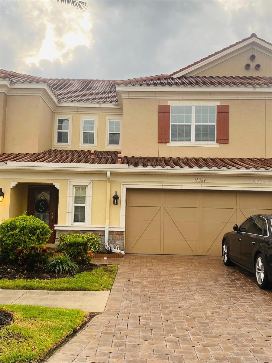 Discover the ideal blend of convenience and comfort in this stunning TERRACINA townhome. Perfectly situated for an effortless lifestyle, this 3-bedroom, 2.5-bath residence is a rare find. Enjoy a prime location near the vibrant WESTCHASE and CITRUS PARK areas, putting you just moments away from everything you need. Step inside and be captivated by the elegant upgrades that set this home apart. The main living areas feature beautiful tile flooring, while the staircase showcases rich wood treads. Crown molding adds a touch of sophistication and style throughout. The first floor is dedicated to your relaxation, featuring a spacious and private master bedroom. The gourmet kitchen is a chef's dream, complete with a casual dining area perfect for everyday meals and entertaining. Unwind and take in the serene views from your covered and screened-in patio, which overlooks a beautiful wetlands area—your own private sanctuary. This townhome offers unparalleled convenience, with easy access to a wealth of dining and shopping options. Commuting is a breeze with the Veterans Expressway, Airport, and excellent local schools in close proximity. Don't miss the opportunity to make this exquisite townhome your new oasis. It's more than a home; it's a lifestyle!