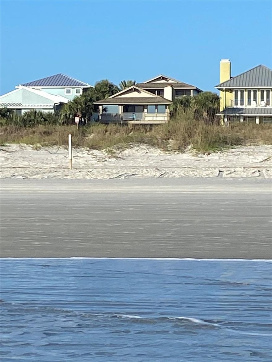 Amazing renovated North Beach 4 BR, 4BTH Oceanfront beach home.  Watch the surfers from your back deck.  Two separate living areas - perfect for Private Residency or Corporate Retreat.  The oceanfront hosts master suite w/sitting area, fireplace and 9' x 26' en-suite/dressing room, Chef's kitchen, custom bamboo cabinets, Sub Zero, Bosch, Wolf & Fisher Paykel appliances, 6'x8' walk-in pantry and cooking island with bar seating.  Family room is relaxing with window seats, fireplace, glass & bamboo staircase and french doors leading to a 19'x19' cedar deck.  A private walled 40'x40' courtyard contains a sparkling swimming pool that separates the main home from additional bedrooms/guest house and kitchenette.  Guest house features 2nd master suite with sitting area, 13'x9' office with built-ins, 12'x7' dressing area and a large en-suite w/glass block & granite shower.  Two additional bedrooms on their private floor, each with 8'8"x4'6" walk-in closet and full bathrooms. Floorings are polished concrete, bamboo wood, Saltillo and travertine tile. The 3 Car garage has built-in storage and laundry area.  Tropical native landscaping extends east through the dunes to the walkway to the beach. ;Water: City