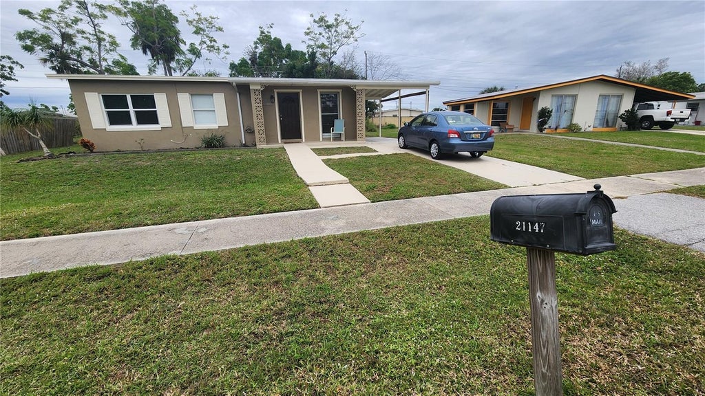Photo of 21147 Bersell Avenue, Port Charlotte, FL 33952 (MLS # A4709556)