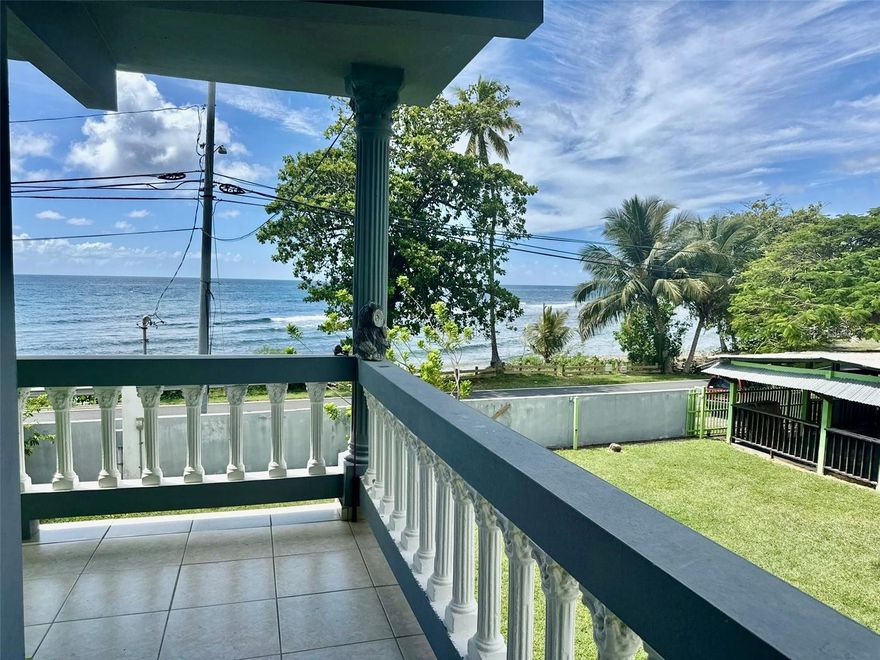 Experience the Caribbean breeze caressing you on the beautiful Guardarraya Beach in Patillas, Puerto Rico, in the southeast of the island. This charming beach residence offers you the unique opportunity to live surrounded by tropical landscapes between mountains and the blue sea, where each day begins with the relaxing sound of the waves and unobstructed ocean views from your own balcony. With a 932-square-meter lot and approximately 1,400 square feet of construction, this property combines spaciousness, an open-concept design, and ceilings up to 10 feet high, allowing natural light and the sea breeze to flow freely throughout the house. It features three comfortable bedrooms and two full bathrooms in the main house, as well as a separate guest house with its own bathroom, ideal for guests, short-term rentals, or as additional private space. The dining room enjoys a dazzling ocean view, creating a unique atmosphere for sharing memorable breakfasts, lunches, or dinners with family and friends, surrounded by an unparalleled natural setting. The property also includes a carport with capacity for four vehicles, which can be used as an outdoor terrace, perfect for social gatherings or moments of relaxation. The beach, literally your front yard, invites you to walk along the shore, relax at sunset, or simply disconnect from the world. Furthermore, the residence is located near local restaurants, food kiosks, and scenic routes along the southeastern coast. Whether as a primary residence, a vacation home, or an investment for Airbnb or VRBO rentals, this beach residence combines charm, comfort, and the authentic Caribbean lifestyle. Appliances Included: Refrigerator, Stove, Washer, Dryer, and Microwave.