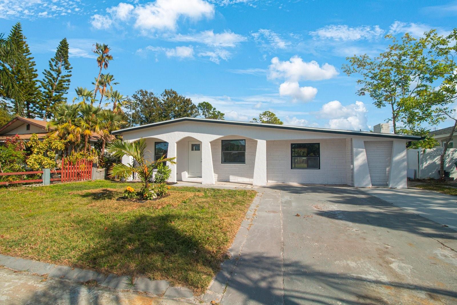 Don't miss this newly renovated 3-bedroom, 2-bathroom home. The sellers have spared no detail in the design from painting the outside of the home white with black accents you'll walk into this spacious open-floorplan with abundant natural light. As you enter the living room you will see the open floorplan. The light wood color luxury vinyl, all new interior doors, gray painted walls, new recessed lighting, new ceiling fans, windows, exterior doors, and sliders. The kitchen has new white wood cabinets with white with gray veins granite and accented with a gray/white backsplash inviting you to come to cook on the brand new stainless steel appliances including stove, microwave, and refrigerator. The bonus room would be a great office/sitting room. You'll love the natural light and sliding door that leads you to the covered porch and spacious backyard. Prime location near restaurants, schools, parks, and shopping. Easy access to downtown Tampa, International Tampa Airport, International Mall, Hyde Park, and I275 highway.