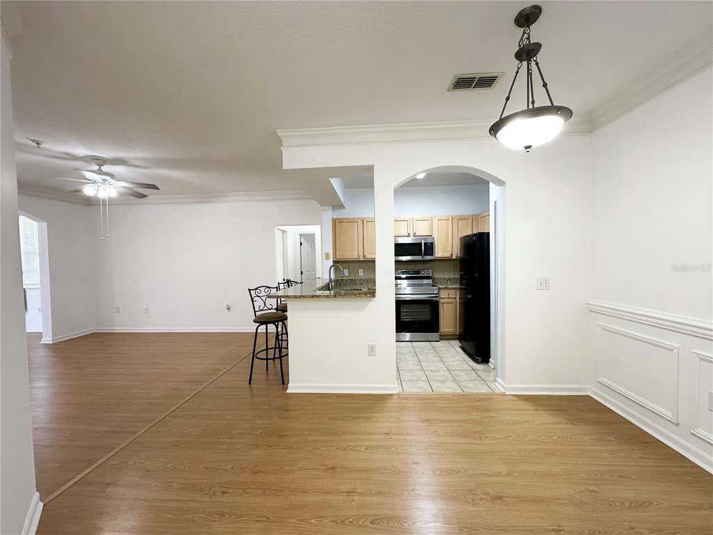 Photo of 12843 Madison Pointe Circle E #201, Orlando, FL 32821 (MLS # O6429837)