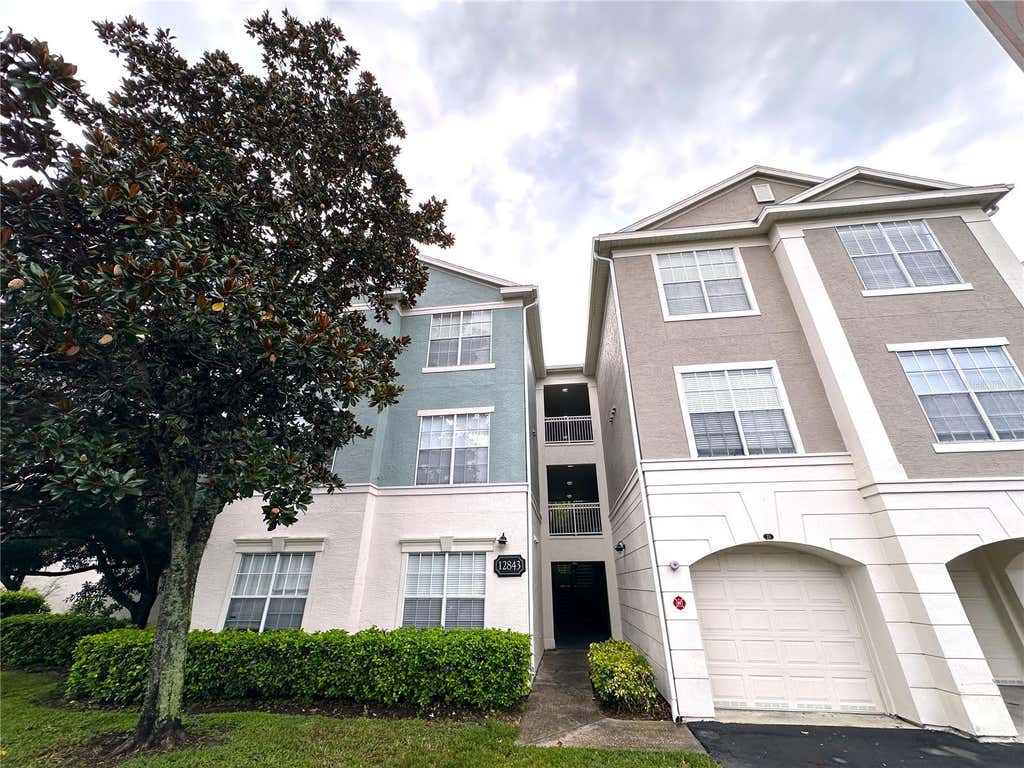 Photo of 12843 Madison Pointe Circle E #201, Orlando, FL 32821 (MLS # O6429837)