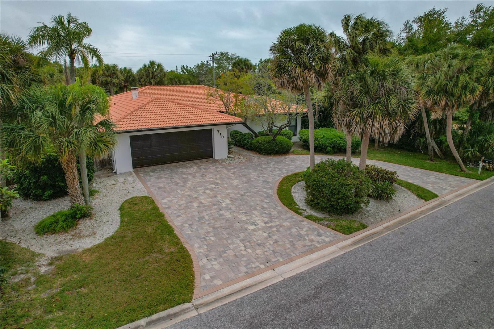 BRAND NEW VINYL BOARD ON BOARD FENCE WITH REINFORCED POSTS HAS BEEN INSTALLED . BEAUTIFULLY UPDATED LANDSCAPE IS ON THE WAY !! THIS GEM STANDS UNTOUCHED BY THE RECENT HURRICANSES. ABSOLUTELY NO DAMAGE !!Your own resort awaits you in the most sought-after Siesta Key. This Paradise has everything that you could possibly think of for a vacation home or a beach style living. Situated on a MORE THAN ONE-THIRD ACRE parcel surrounded by palm trees, home feels like a resort on the first look itself. BRICK PAVED CIRCULAR DRIVEWAY that can easily accommodate about 6 cars along with 2 car garage is just the beginning. FRESHLY PAINTED EXTERIOR AND INTERIOR 2023 is refreshing. Home opens into a huge open concept Family/Dining/Kitchen that is just perfect. NEW WATERPROOF OPTIMAX LUXURY VINYL FLOORING, 2023 throughout the house is beautiful. Neutral colors provide plenty of opportunity for decorating the house according to your taste. Kitchen offers solid granite countertops and comes with all the appliances included. Don't forget to notice the BEAUTIFUL BUILT-IN entertainment area. Two separate patio doors open into the back patio from the living area. NEWLY RENOVATED BATHROOMS 2023 will amaze you. Master bedroom suite has its own separate access to the pool area. Two other bedrooms completely separate from Master suite offers plenty of privacy for everyone. ENJOY A PRIVATE OFFICE WITH ITS OWN FULL BATHROOM for a workday privacy. Office has its own external door. Backyard with huge, heated pool surrounded by palm trees is literally a paradise resort. Plenty of space around the pools for all kinds of beach chairs and outdoor cooking. Enjoy the luxury of resort experience while at home. ZERO MAINTAINANCE POOL!! SALT WATER POOL WITH BRAND NEW SALT CHLORINATOR is a relief. BRAND NEW VARIABLE SPEED HIGH EFFICIENCY 18 SEER AC UNIT gives you a breeze. Fresh Epoxy floor in the garage. Siesta Key mall is 5 mins away. Walk or bike to the beach because it is literally right around. Schedule your private showing today!!!