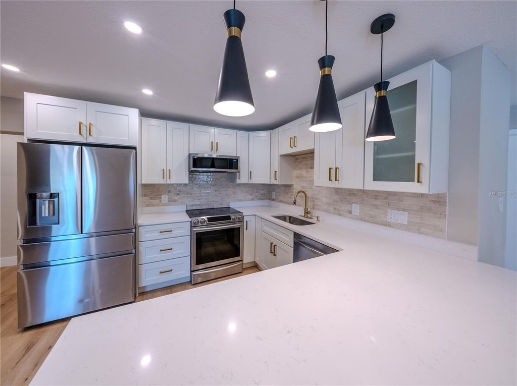 Photo of 4945 Lescot Lane, Orlando, FL 32811 (MLS # O6409608)