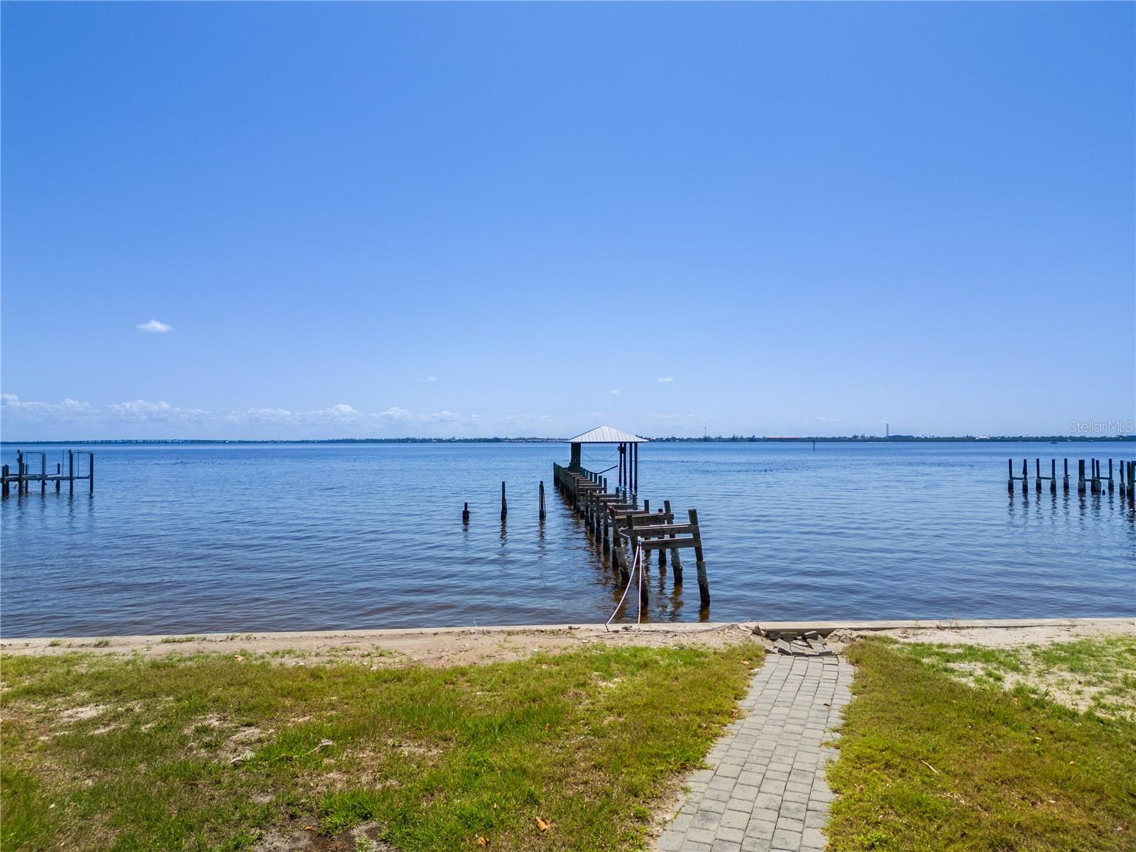 Huge Price adjustment! Best price on the Peace River - Rarely available, almost half an acre dream home vacant lot on the Peace River with direct access to Charlotte Harbor into the Gulf of Mexico.
Offering plenty of room for your dream home will you will see spectacular sunrises and sitting on your own dock, you will see unforgettable sunsets! This is where memories will be made, on your own piece of property in Paradise!
Dock will need repairs, boat house cover, seems to have faired well and seawall looks good.
Survey can be provided to serious buyers along with names of custom builders and engineering firm, if needed.
Lot looks over the historic Punta Gorda, Peace River and Charlotte Harbor! Close to dining, shopping, golf, Sunseeker Resort, beaches, I-75, airports. Don't miss out on this private lot on the Peace River they are not making anymore of it!