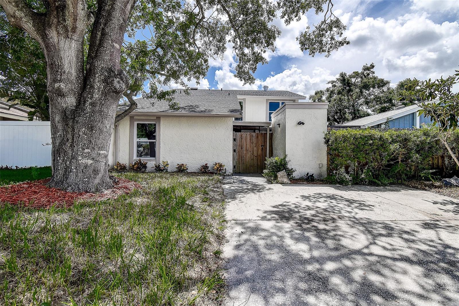 Fully updated 3 bed, 2 bath, 2 story in Plantation of Carrollwood. Your front patio is fenced, screened and partially covered. You enter into open living and kitchen area, room for 4 at the granite kitchen counter. Off the kitchen is a small fenced patio great for grilling or a small pet walk. The first floor also has the primary bedroom, bath and laundry closet. Upstairs are two large bedrooms, bath and a study area. All kitchen and bathroom cabinets w/granite countertops, new impact windows and sliders, luxury vinyl flooring throughout, baseboards, appliances, paint, roof and HVAC.
PLANTATION of CARROLLWOOD is a Deed Restricted.
Community consists of 18 villages with 1832 homes on 520 acres of land. Common Areas of 119 acres throughout the community: 55 acres of lakes and 64 acres for recreation activities which include our Clubhouse, tennis courts, baseball, volleyball and soccer fields; swimming pools, handball courts and playgrounds.