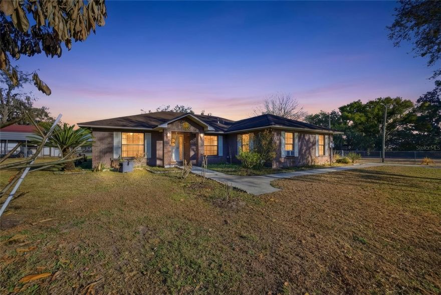 Situated on 1.33 acres in Plant City with no HOA, this well-maintained 3-bedroom, 2-bath block home offers the space, flexibility, and lifestyle you’ve been looking for. Zoned Agricultural, farm animals are welcome, and multiple fenced areas are already in place—making it easy to bring your animals and settle right in.

The 1,620 sq ft main home features an open-concept layout with vaulted ceilings in the living area, a dedicated dining space, and an inside laundry room. The kitchen is equipped with stainless steel appliances and breakfast bar. Enjoy peaceful evenings on the screened-in rear lanai overlooking your peaceful acreage setting and farm animals.

A standout feature of this property is the 480 sq ft accessory dwelling unit (ADU), ideal for multigenerational living, rental income potential, guest quarters, or a private workspace. The ADU includes a bedroom, living area, kitchenette, full bathroom with washer hookup, and its own split A/C system (installed 2022).

Additional features include:
• RV water and electric hookup
• Covered RV parking port
• Shed with custom chicken coop 
• Septic system replaced in 2022
• A/C replaced in 2022
• Electrical updates completed in 2022.

Located on a road primarily lined with open strawberry fields, the property offers a peaceful country setting while remaining conveniently positioned between Tampa and Orlando, with easy access to Hwy 60 for commuting.

Whether you’re looking for room to spread out, space for animals, or income potential, this property offers versatility and long-term value in a desirable Plant City location.