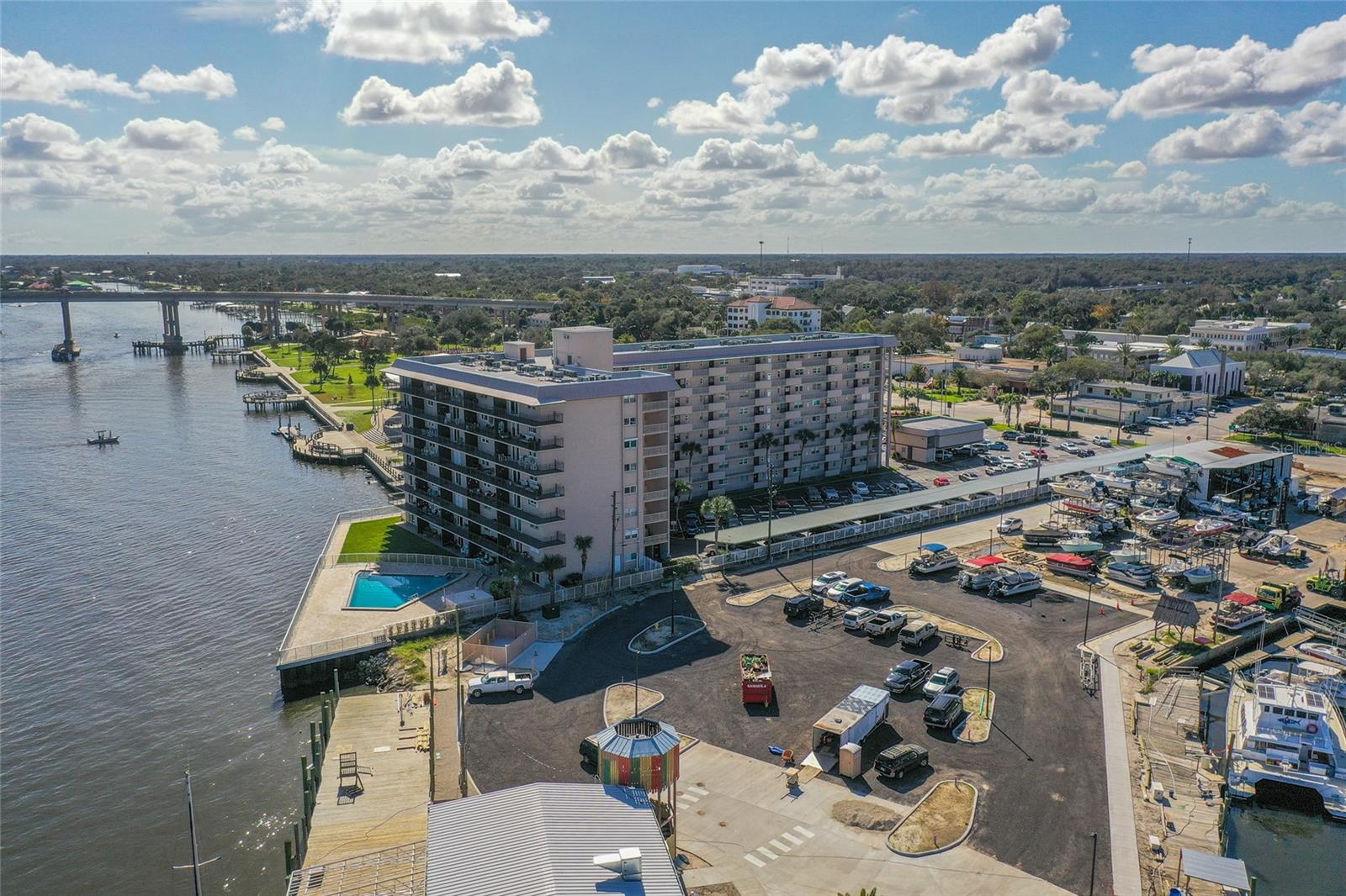FIRST TIME EVERY OFFERED!!! Rare direct Intracoastal Waterway frontage with amazing views. Enjoy the firework events space launches and annual Christmas boat parade from your unit and patio. One of New Smyrna Beach's best values & locations, just a stroll to dining, shopping, galleries and more. Unit 102 offers assigned parking and covered rear patio overlooking pool and Intracoastal waterway. The Captains Quarters has boat slips for rent (currently there is a list), clubhouse with kitchen and large pool. This unit has never been offered for sale, it is clean and ready move in with vinyl and tile flooring throughout, or ready for you to add your own touches. Captains Quarters is a very well-maintained 55+ community, they have received their required Milestone Inspection Certificate in July 2022. Please call your agent to schedule your tour today before its SOLD!!!