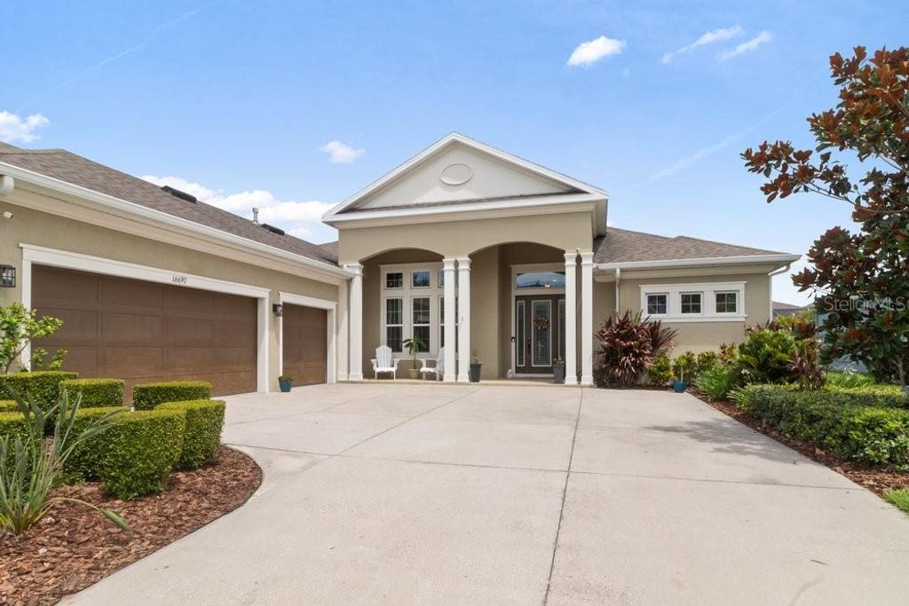 Photo of 16697 Courtyard Loop, Land O Lakes, FL 34638 (MLS # W7875780)